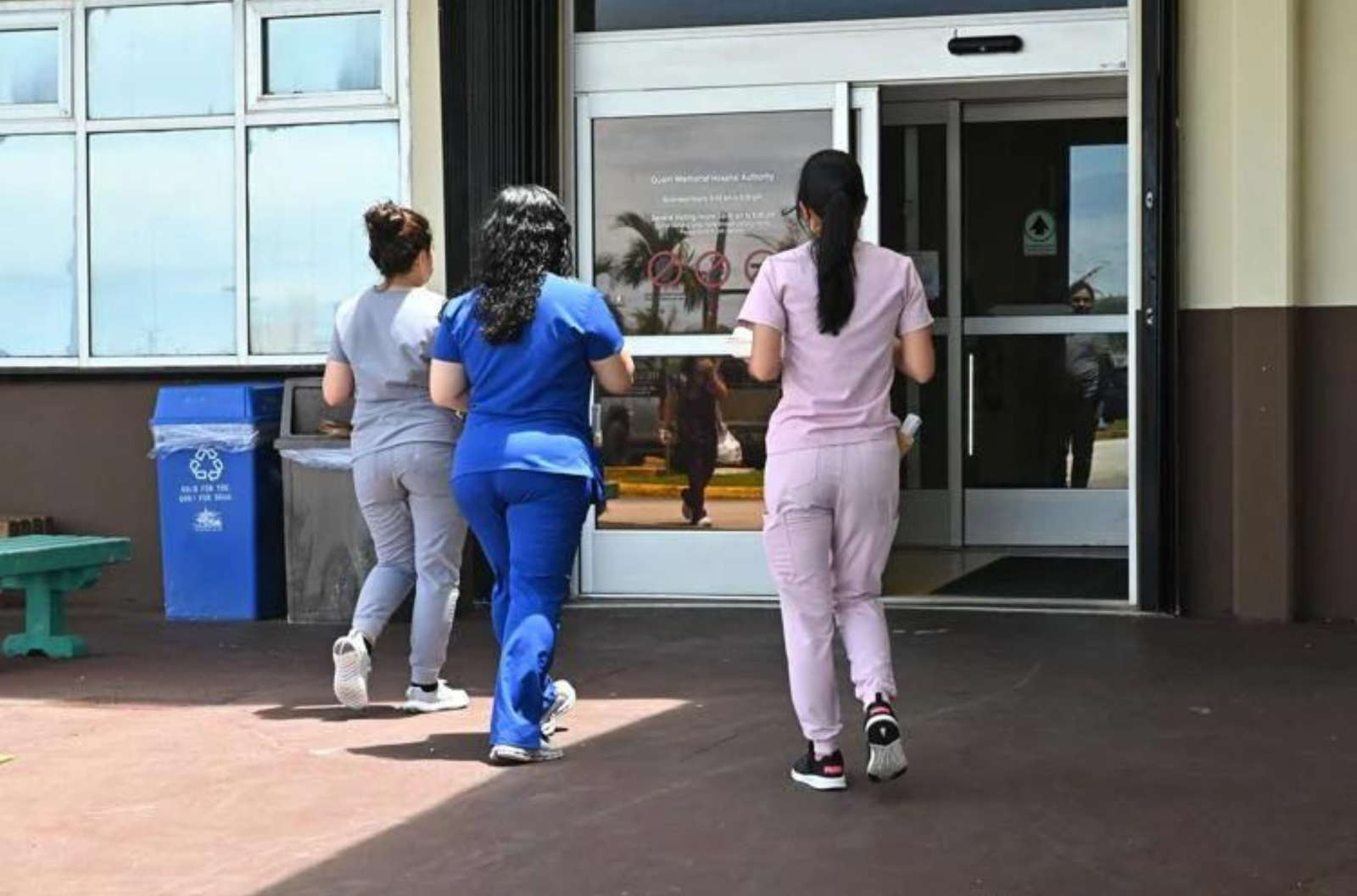 Medical personnel enter Guam Memorial Hospital on Monday, July 10, 2023, in Tamuning. 