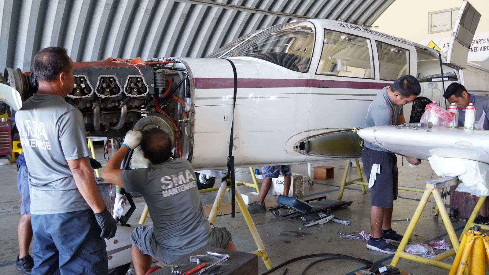 Mechanics hard at work in Tinian Hangar