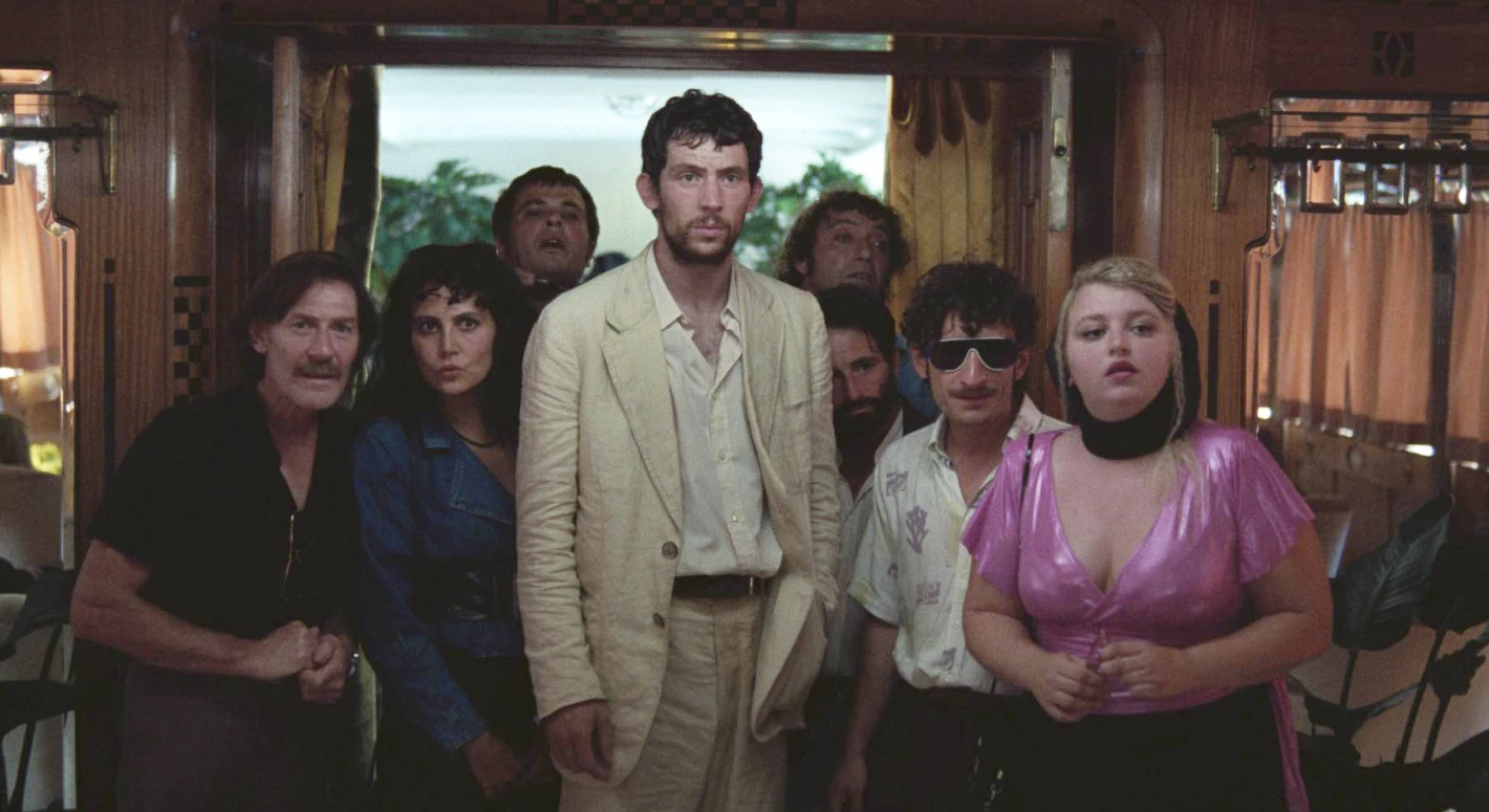 Josh O’Conner, center, in a scene from “La Chimera.”