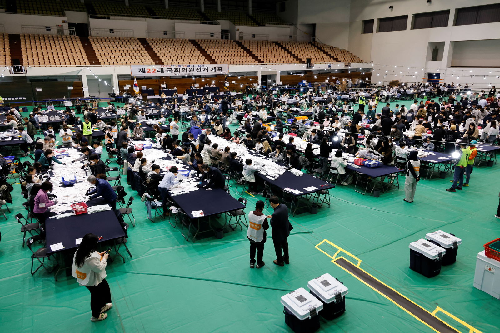 National Election Commission officials count ballots during the 22nd parliamentary election in Seoul, South Korea, April 10, 2024.