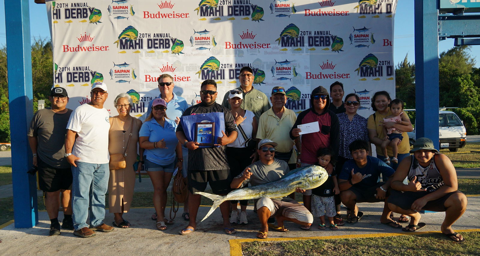 The crewmembers of Ten-Seven pose with their winning mahi and Saipan Fishermen Association officials at the conclusion of the 20th Mahi Mahi Fishing Derby at the Smiling Cove Marina on Saturday.
