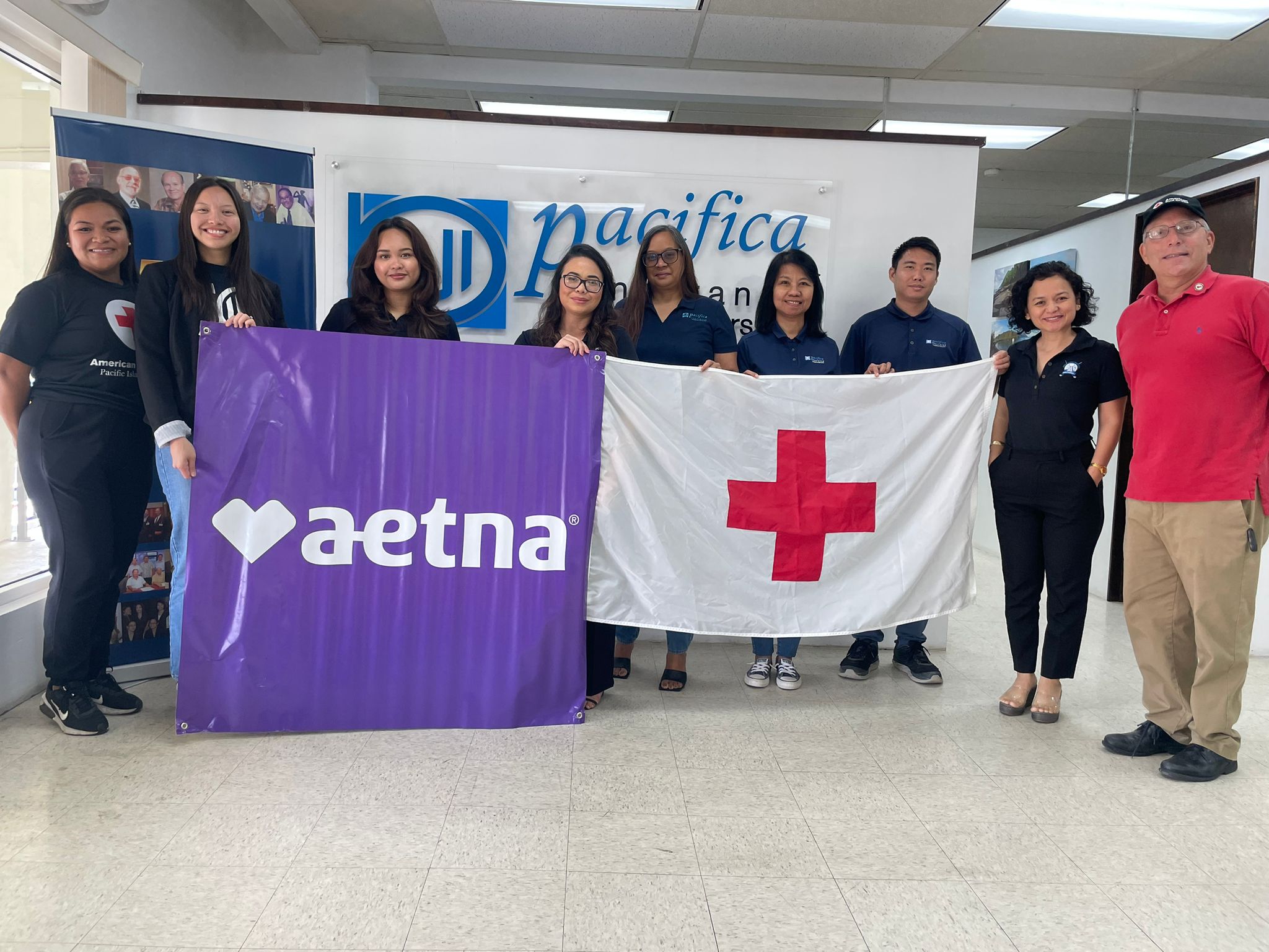Aetna International General Agent Pacifica Insurance Underwriters Inc. leadership and team with Red Cross staff.