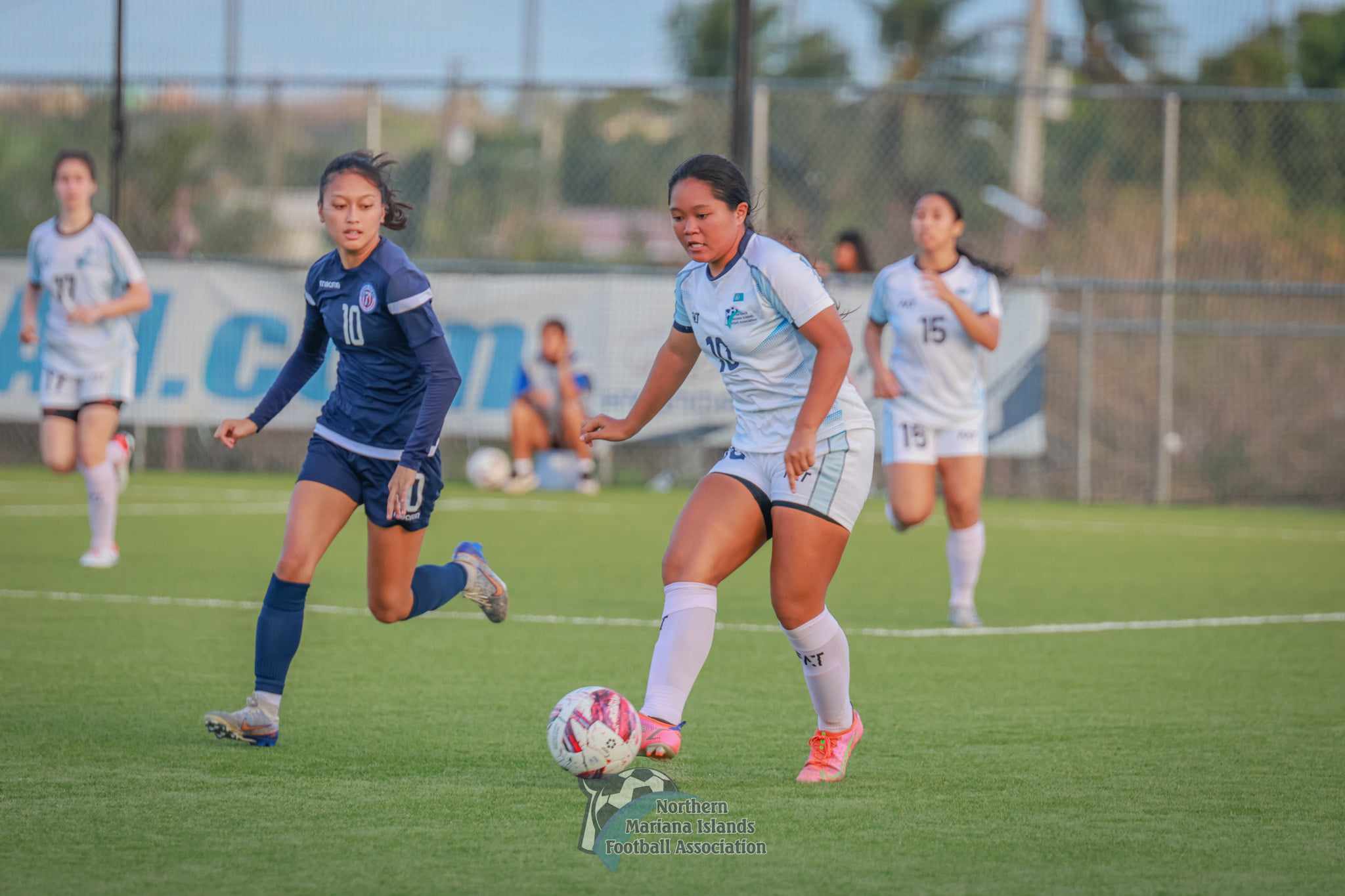 NMI's Pia Ngewakl dribbles past a Guam defender during a friendly match over the weekend at the NMI Soccer Training Center in Koblerville.