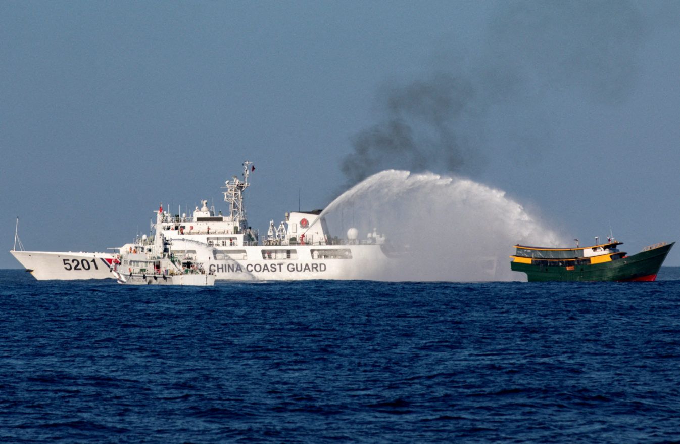 Chinese Coast Guard vessels fire water cannons towards a Philippine resupply vessel, Unaizah May 4, on its way to a resupply mission at Second Thomas Shoal in the South China Sea, March 5, 2024.