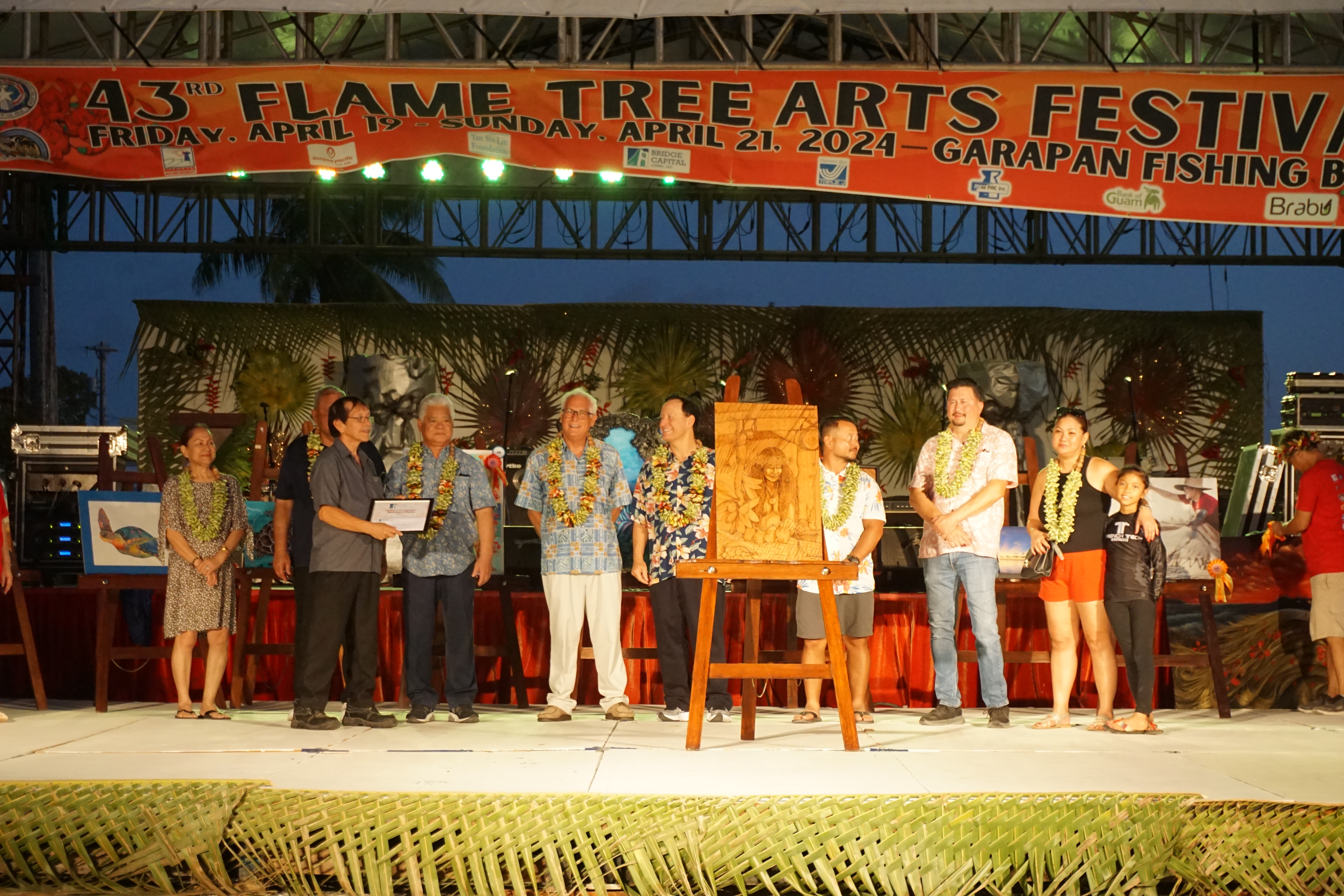 Richard Manglona holds his award certificate as he poses for a photo with Bridge Capital LLC principals, Gov. Arnold I. Palacios, Lt. Gov. David M. Apatang, first lady Wella Palacios and the competition judges: House Vice Speaker Joel Camacho, House Floor Leader Edwin Propst and Senate Floor Leader Corina Magofna.