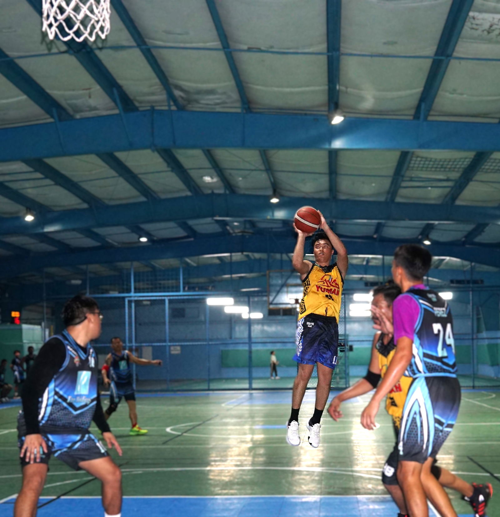 Yuman's Justine Enano pulls up for the mid-range jumper during a playoff game in season 2 of the Legends Sports Association Invitational Basketball League at the TSL Sports Complex on Sunday.