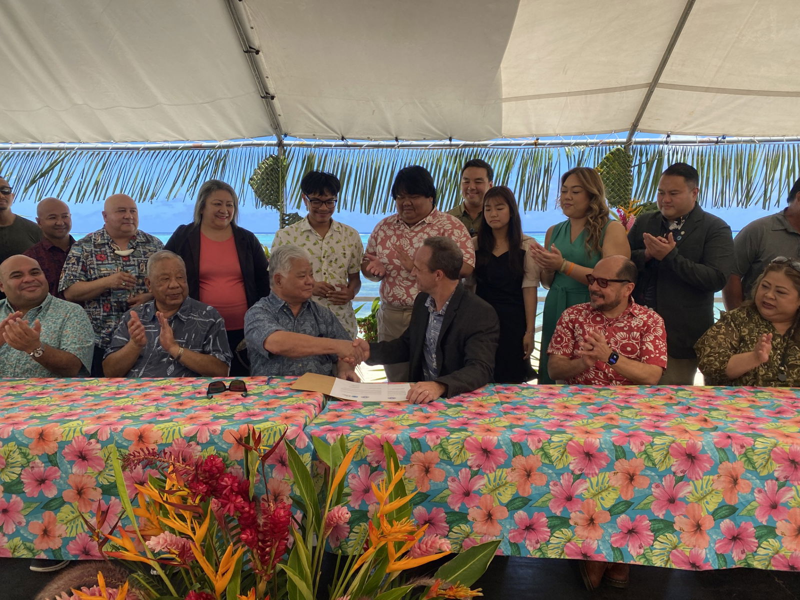 Gov. Arnold I. Palacios shakes hands with Francois Rogers, executive director of the Blue Planet Alliance, at the signing Monday of an MOU regarding the CNMI’s commitment to 100% renewable energy by 2045.