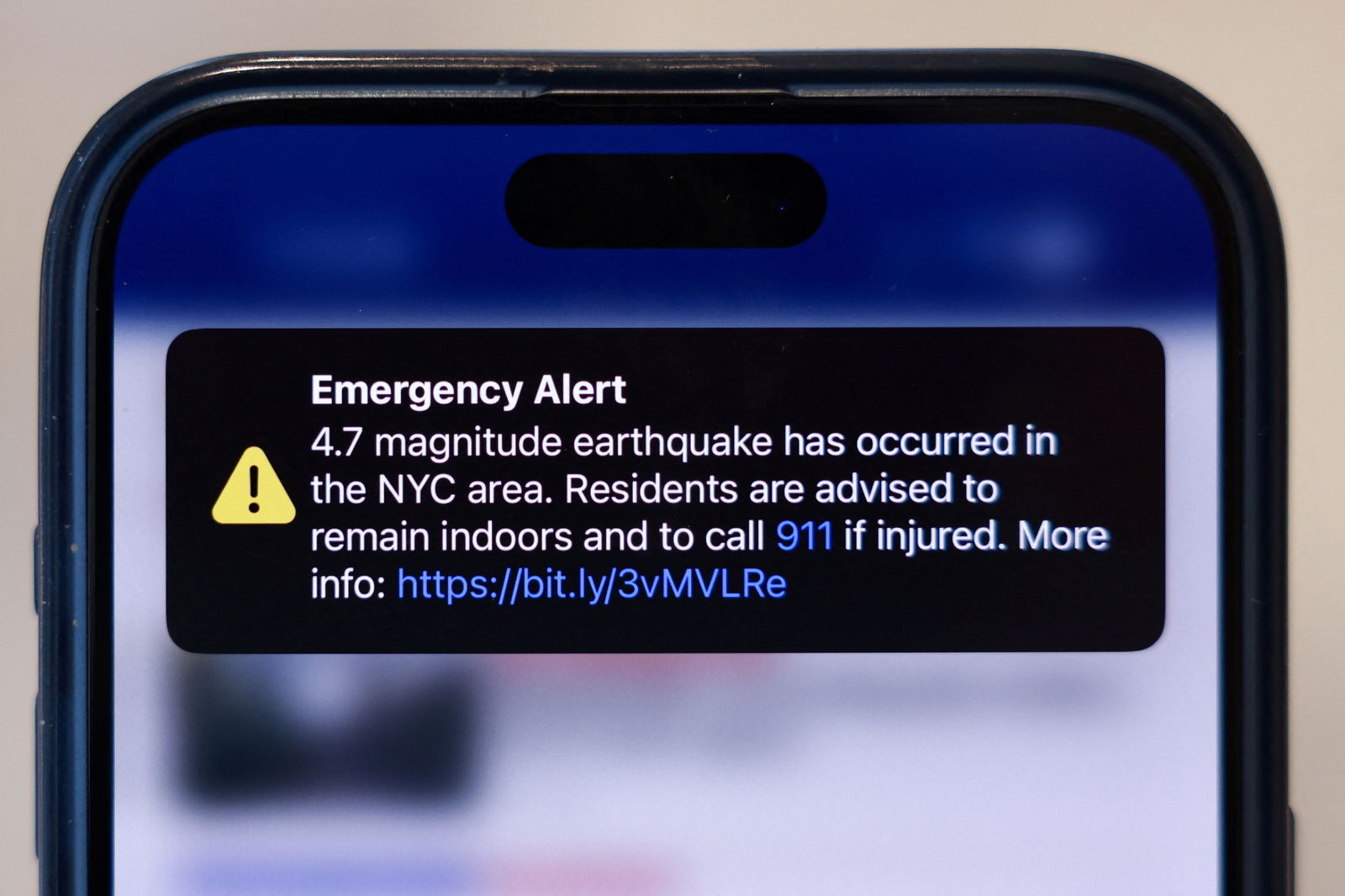 An emergency alert of a magnitude 4.7 earthquake is seen on a cellphone in New York City, U.S., April 5, 2024. 