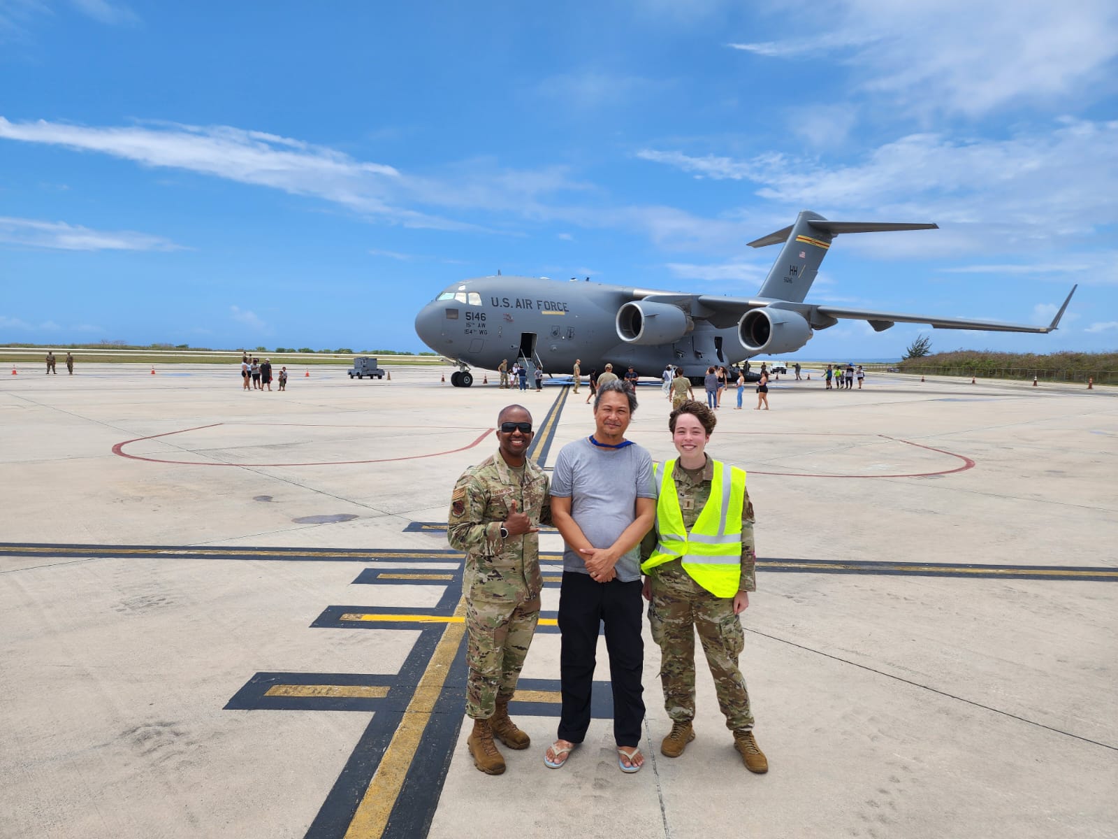 15th Wing Command Chief Master Sgt. Anthony Thompson Jr., left, and public affairs officer 1LT Margaret Blice, right, pose with Variety reporter Emmanuel T. Erediano during Agile Reaper 24 Community Day on Saturday at the Francisco C. Ada/Saipan International Airport.