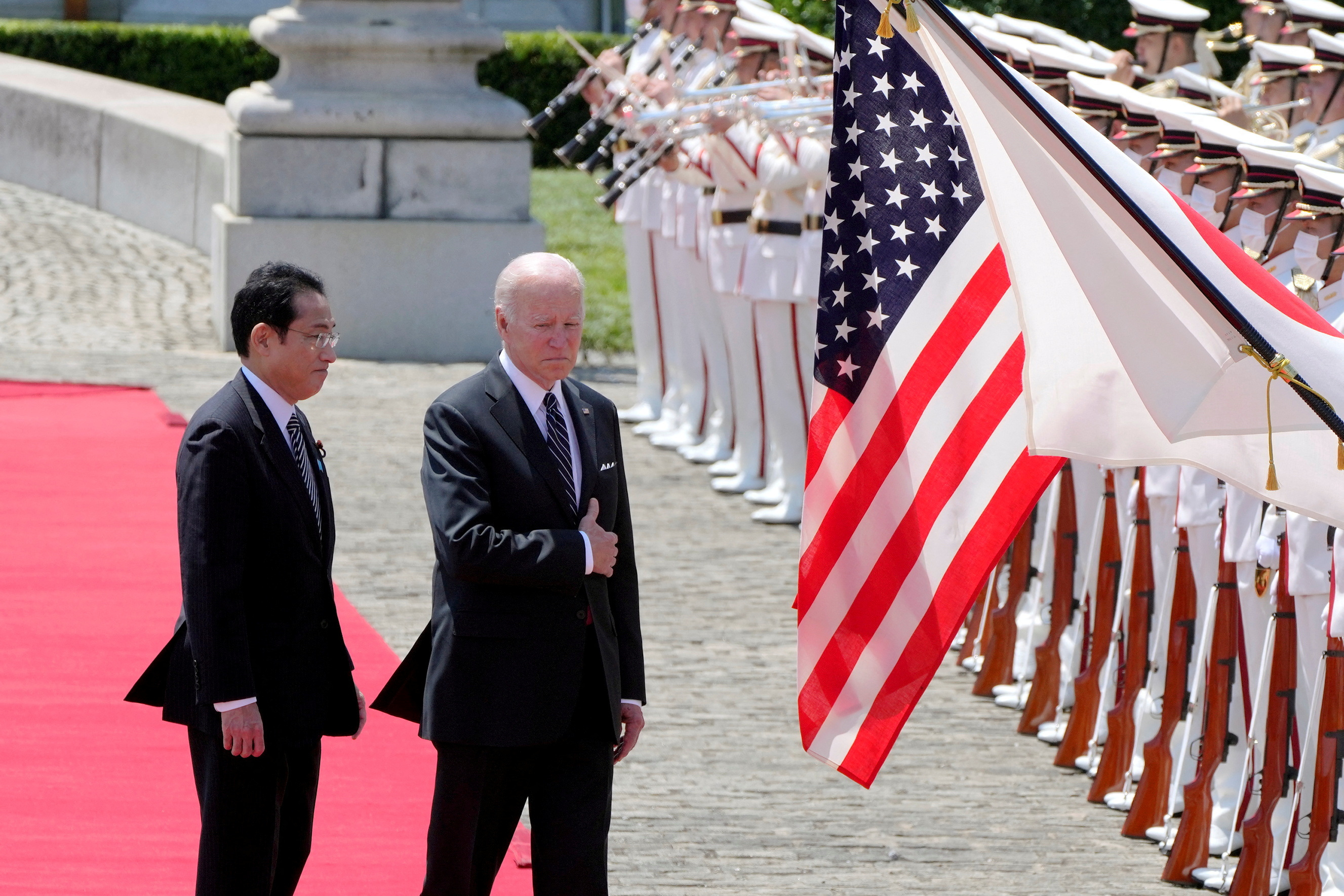 FILE PHOTO: U.S. President Joe Biden and Japanese Prime Minister Fumio Kishida review an honor guard during a welcome ceremony for President Biden, at the Akasaka Palace state guest house in Tokyo, Japan, May 23, 2022. 
