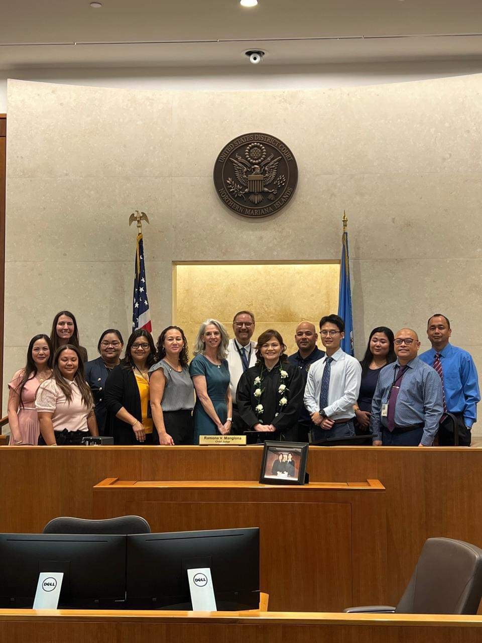 District Court for the NMI Chief Judge Ramona V. Manglona poses for a photo with Magistrate Judge Heather L. Kennedy and district court staff during Judge Manglona’s swearing-in ceremony.