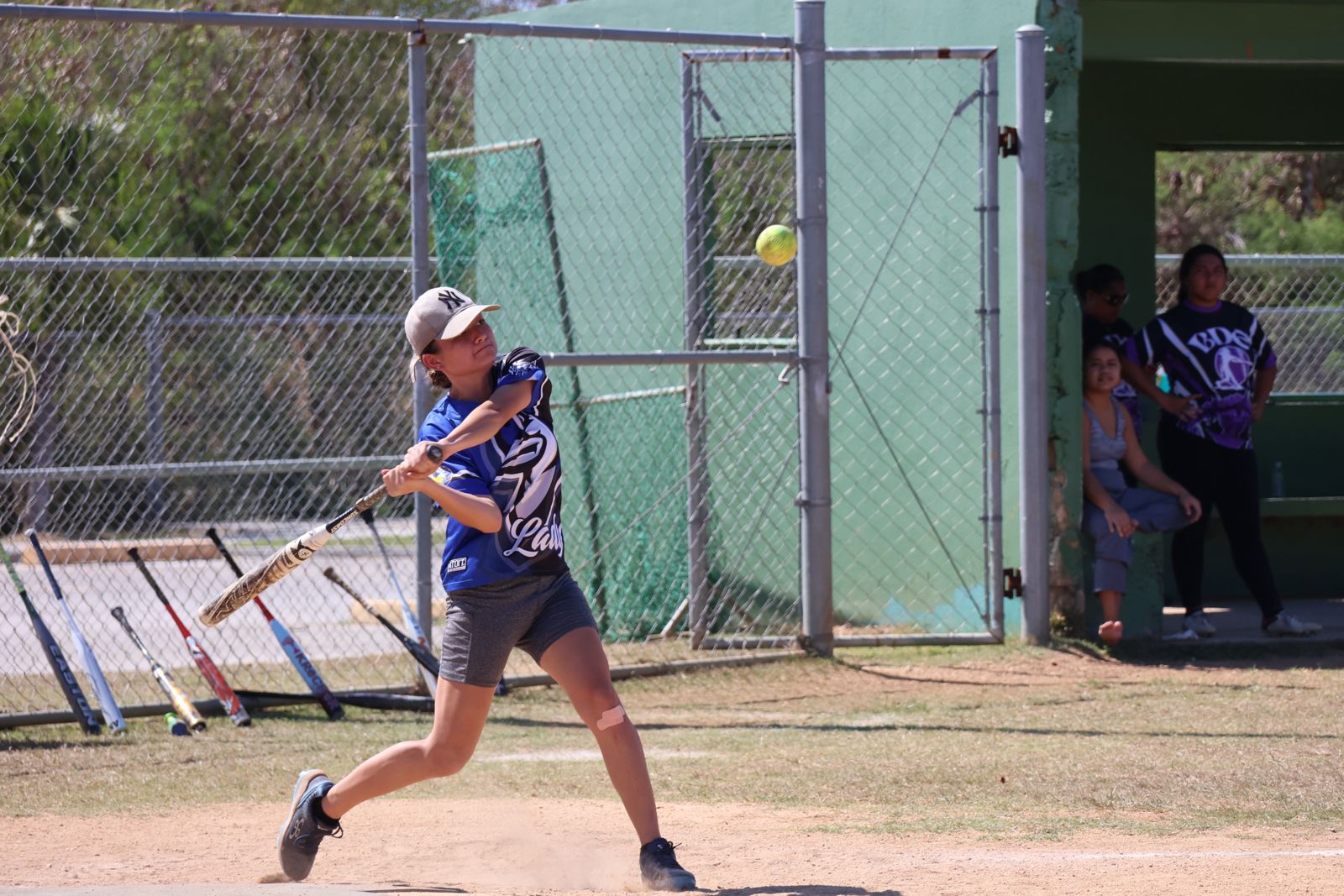Lady Blue Jays' Kiana “Baby K” Camacho connects a single against BDE during game 1 in the ladies division championship series of the 2024 Budweiser Belau Amateur Softball Association League at the Dandan baseball field on Sunday.