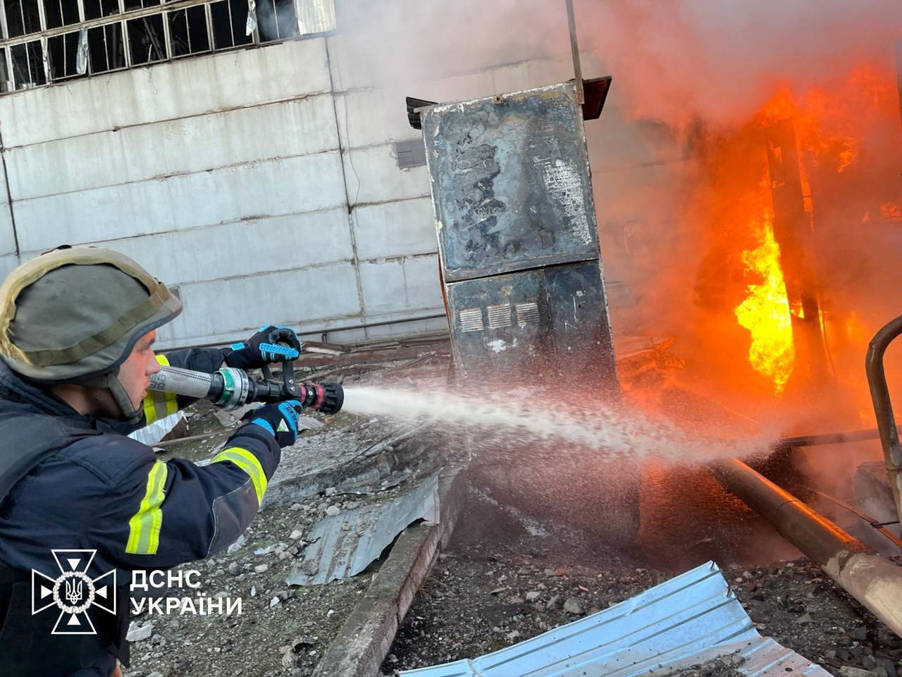 A firefighter works at a compound of power infrastructure facilities, which was hit by Russian missile and drone strikes, amid Russia's attack on Ukraine, at an undisclosed location in Ukraine April 11, 2024. 