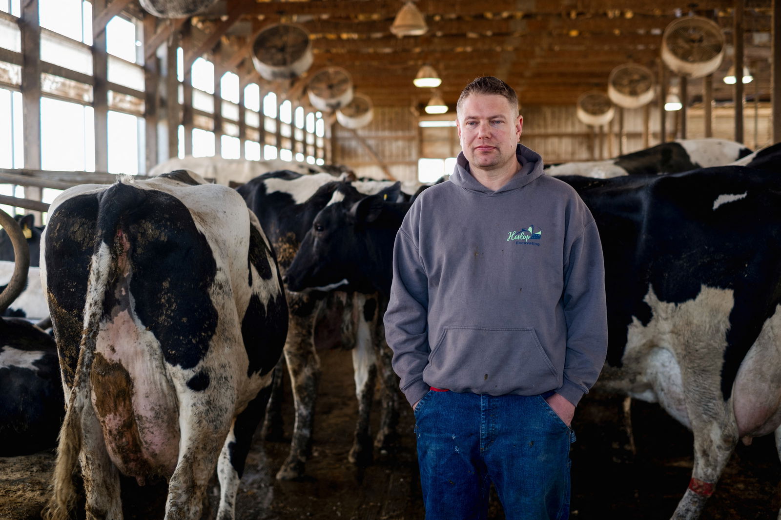 Dairy farmer Brent Pollard stands for a portrait inside of a cow pen at his farm in Rockford, Illinois, U.S., April 9, 2024. 