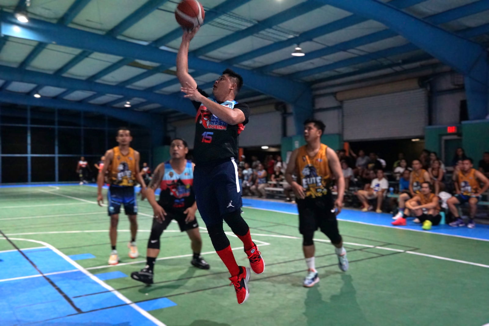 Lamesa Kusina's Paul Flores takes the floater during a playoff game against Elite Force in season 2 of the Legends Sports Association Invitational Basketball League at the TSL Sports Complex on Tuesday.