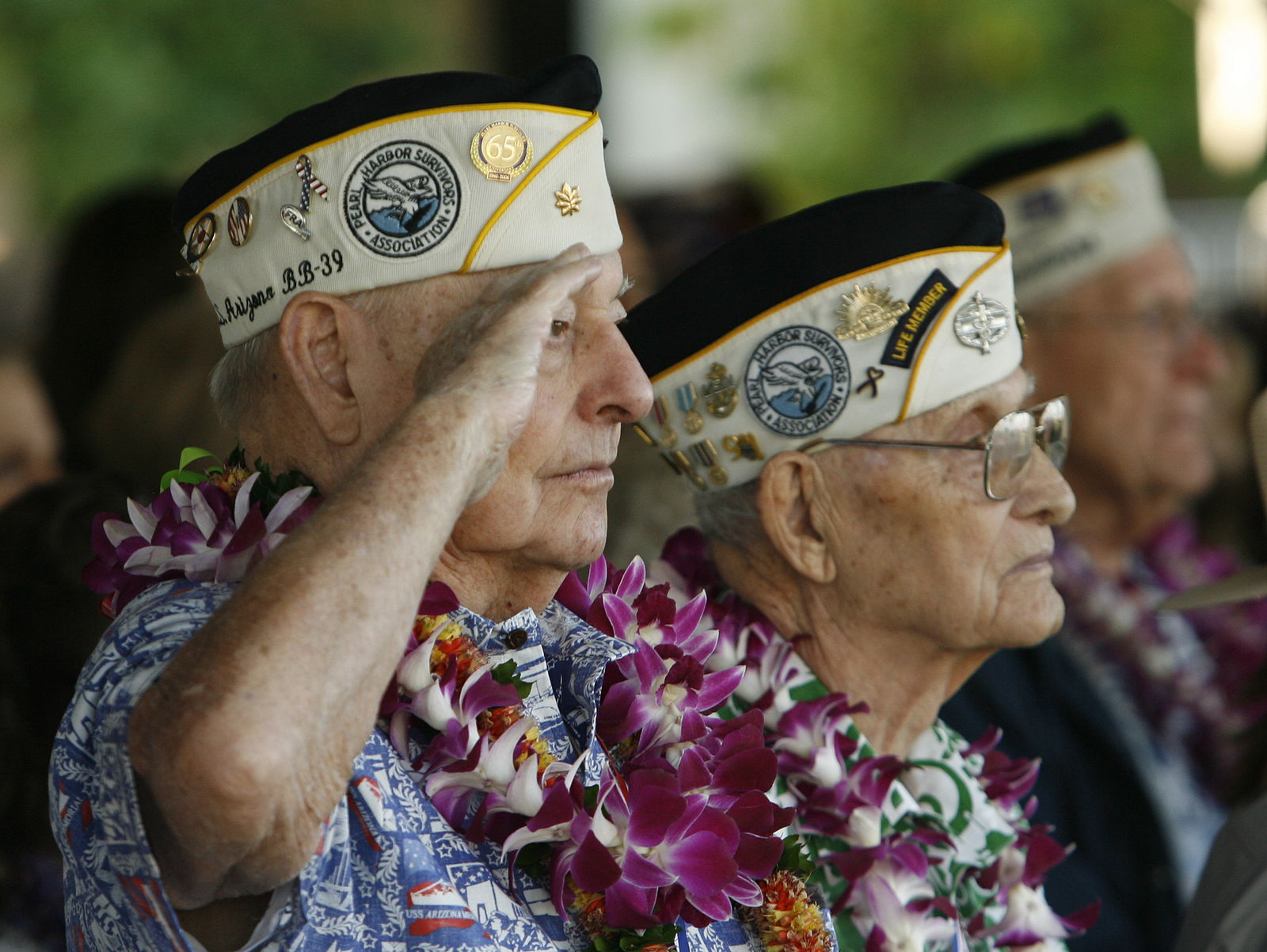 USS Arizona survivor Louis Conter salutes during the "Moment of Silence" during the 72nd anniversary of the attack on Pearl Harbor at the WW II Valor in the Pacific National Monument in Honolulu, Hawaii on December 7, 2013. 