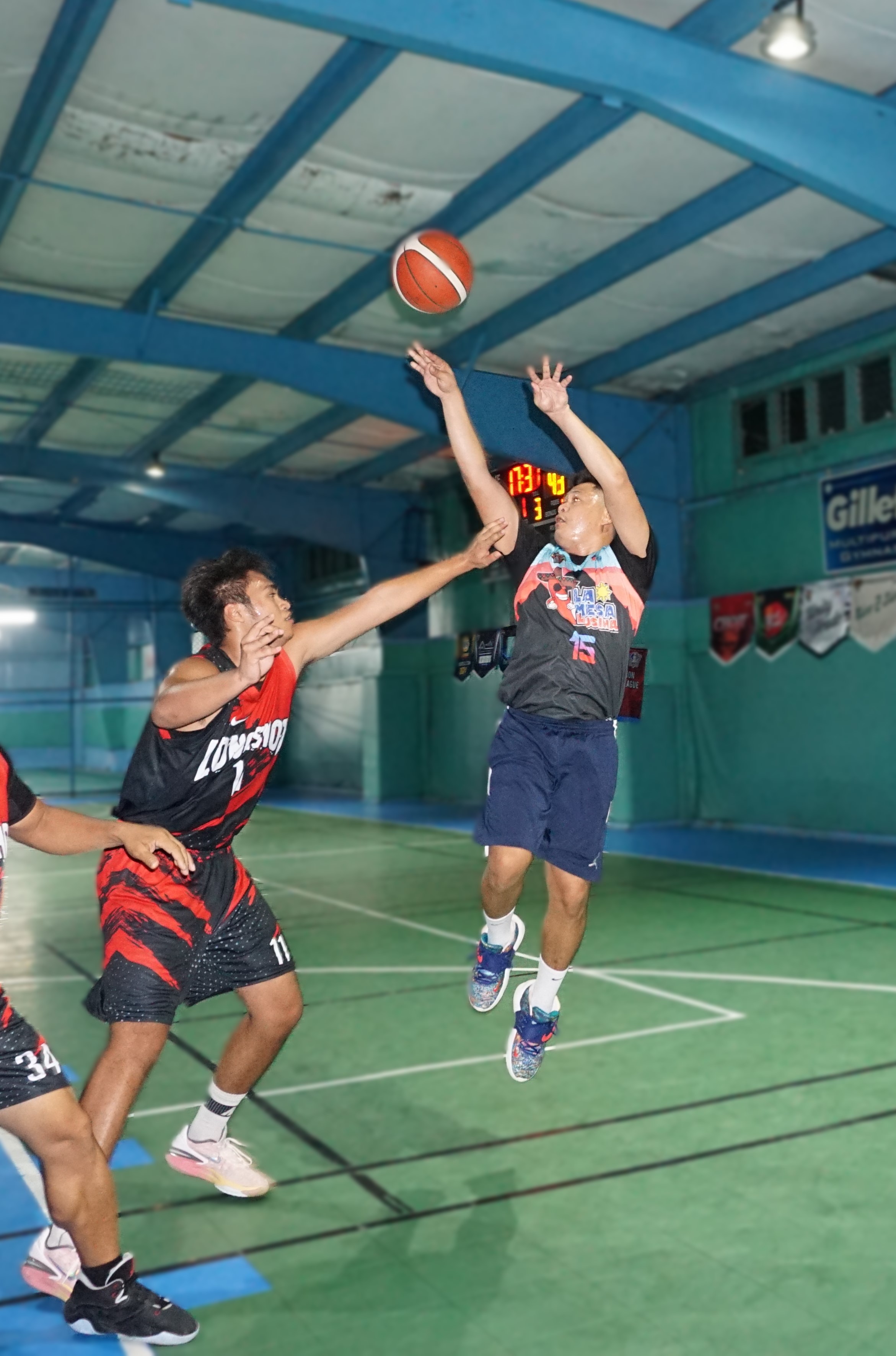 Lamesa Kusina's Paul Flores takes the fadeaway jumper against Longshot in a Legends Sports Association Invitational Basketball League game at the TSL Sports Complex.
