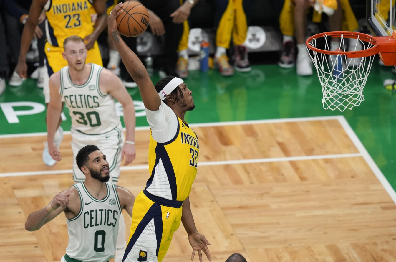 Indiana Pacers center Myles Turner (33) dunks the ball against Boston Celtics forward Jayson Tatum (0) during the second quarter of Game 1 of the NBA Eastern Conference finals on Tuesday, May 21, 2014, in Boston.