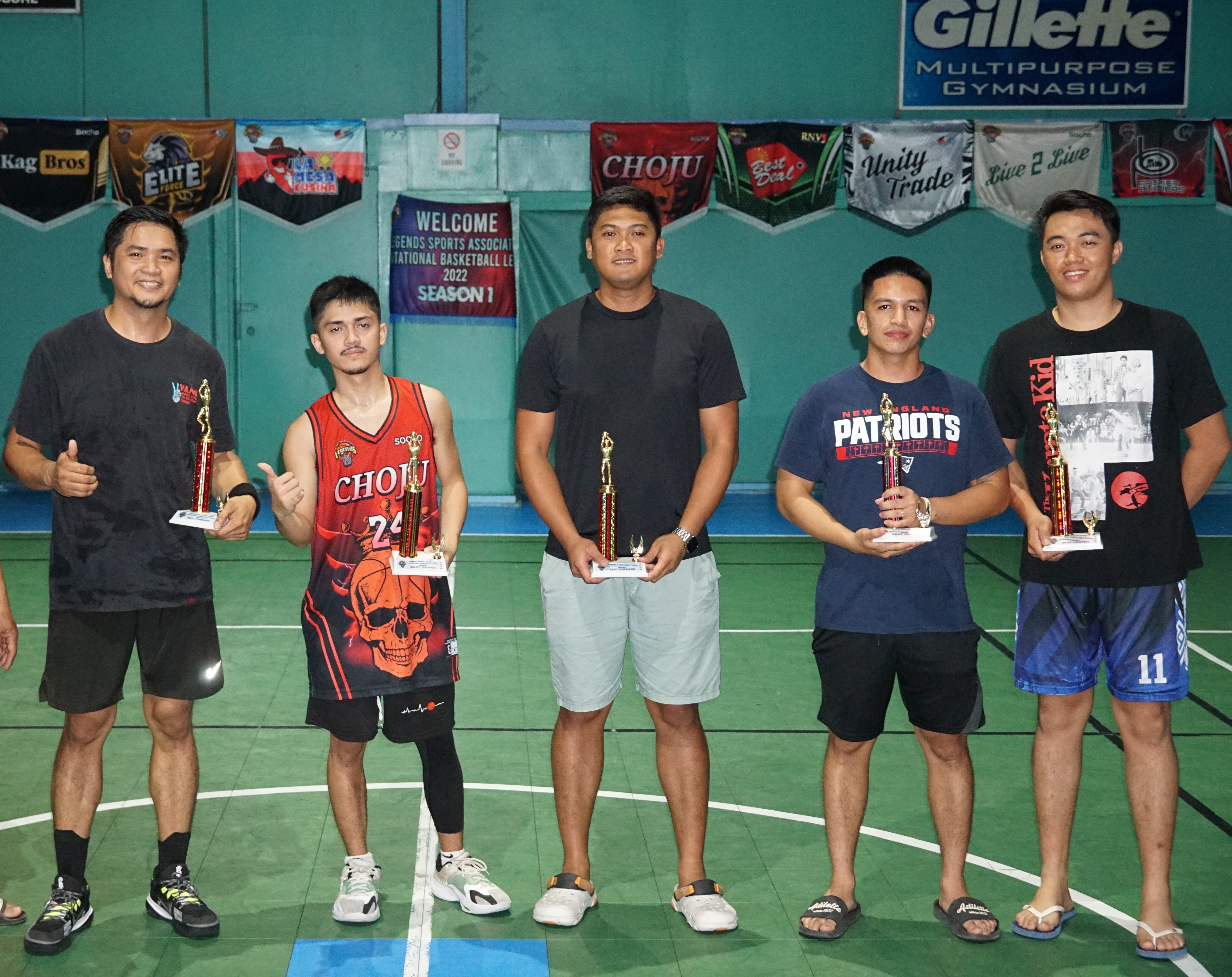 From left, Julius Domine, Jay Art Palmes, Nikko Mejarito, Carl Aldan, and Justine Enano pose with their Mythical 5 trophies during the awards ceremony of the Legends Sports Association Invitational Basketball League, season 2 at the TSL Sports Complex on Saturday.