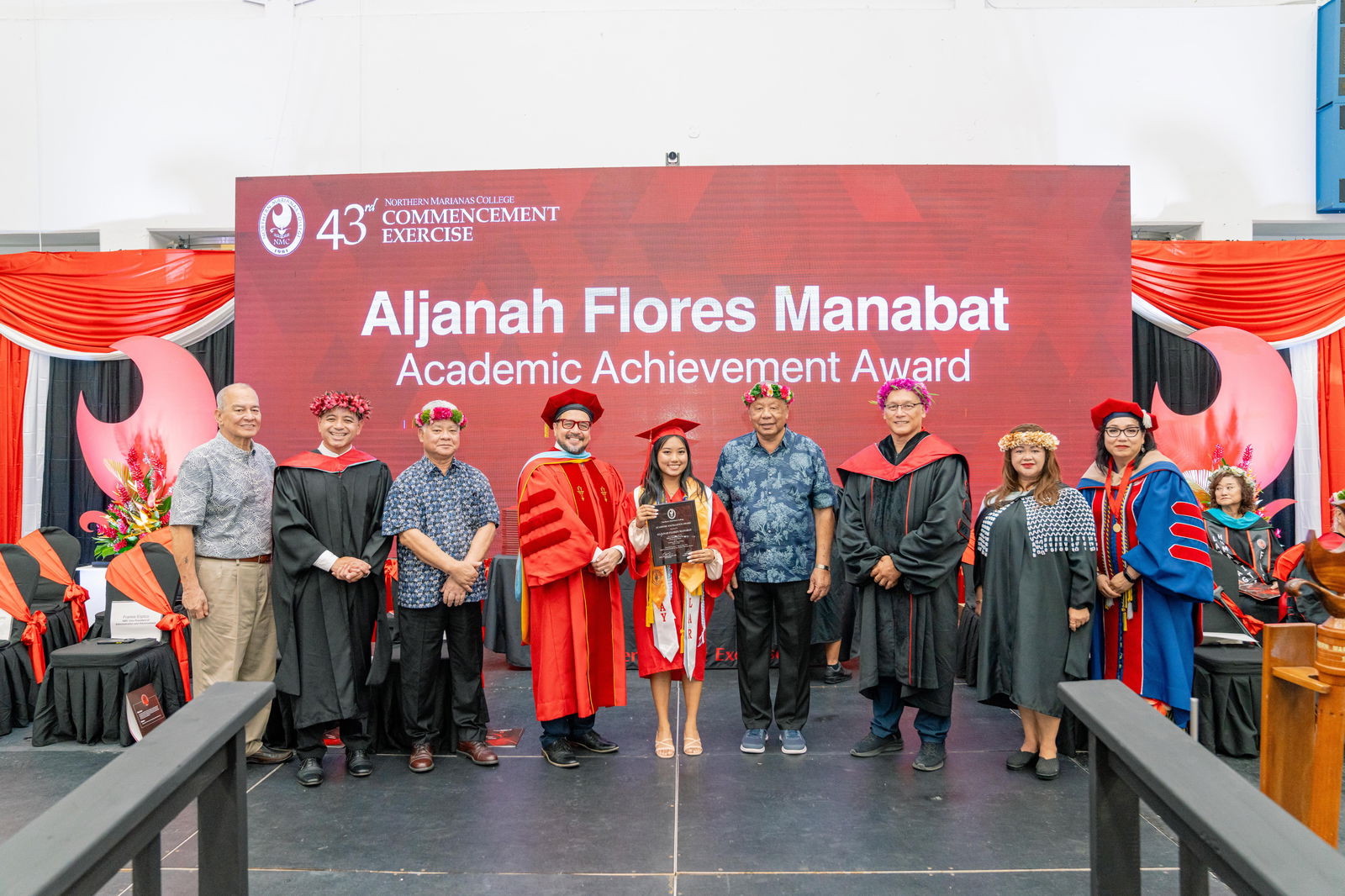 Aljanah Flores Manabat, who graduated summa cum laude with an Associate of Arts in Liberal Arts, was honored with the Academic Excellence Award at Northern Marianas College’s 43rd Commencement Exercise on May 17, 2024, at the Marianas High School Gymnasium. Pictured with Manabat, from left, are keynote speaker U.S. Congressman Gregorio Kilili Camacho Sablan, NMC Vice President for Administration and Advancement Frankie Eliptico, CNMI Gov. Arnold I. Palacios, NMC President Galvin Deleon Guerrero, EdD, CNMI Lt. Gov. David M. Apatang, NMC Board of Regents Chair Charles Cepeda, NMC Dean of Student Support Services Charlotte Cepeda, and NMC Acting Dean of Academic Programs and Services Dr. Barbara Hunter.