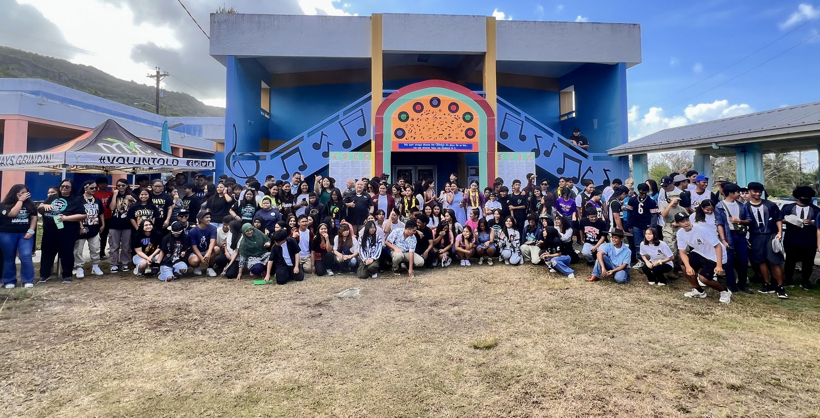 Students and staff of Dr. Rita Hocog Inos Junior-Senior High School pose for a photo with Commissioner of Education Dr. Lawrence F. Camacho, Rota Mayor Aubrey Hocog, Senate Vice President Donald Manglona, Guam Visitors Bureau officials, media members and social media influencers.