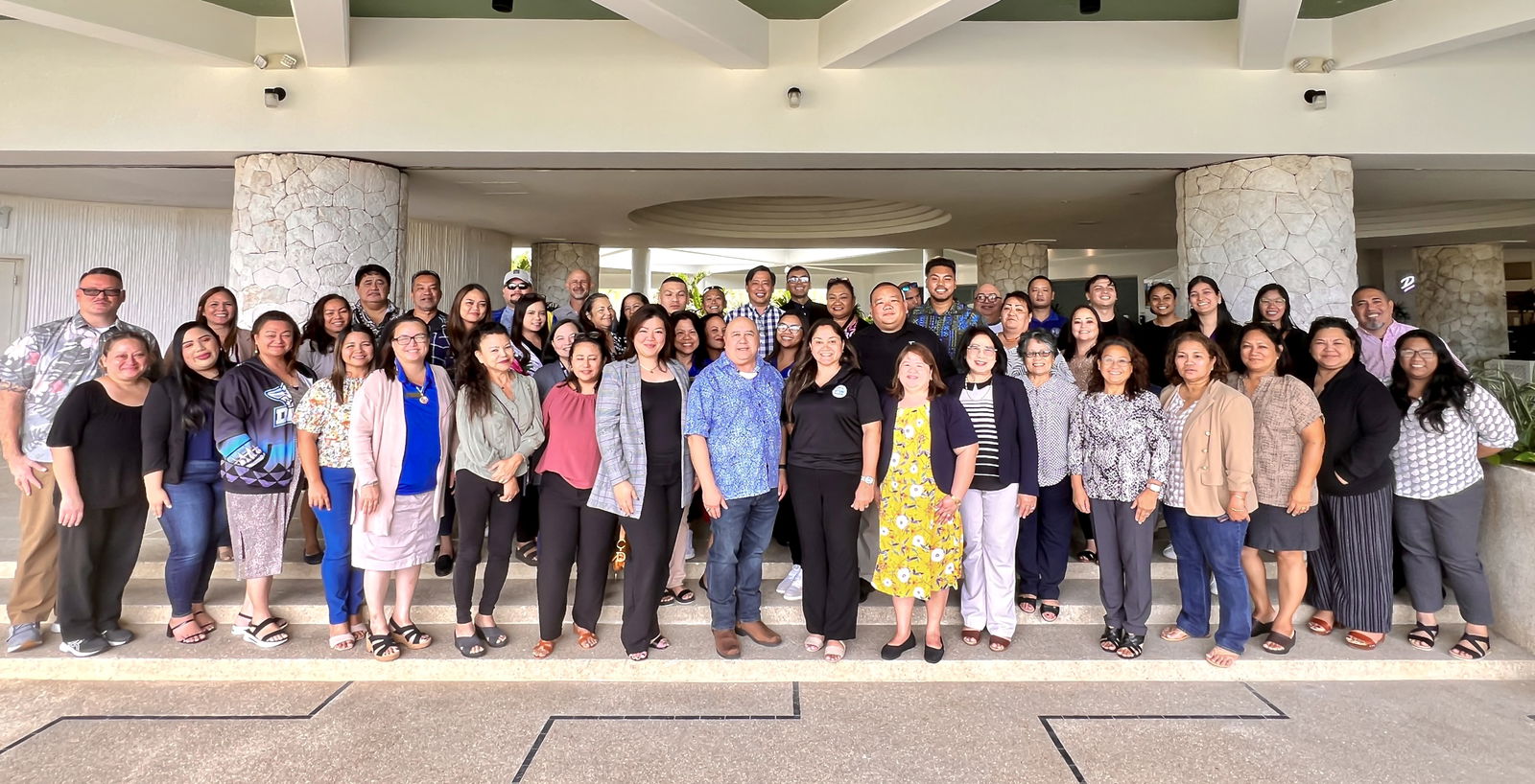 Commissioner of Education Dr. Lawrence F. Camacho poses for a photo with Public School System principals from Rota, Tinian, and Saipan, program managers and program coordinators.