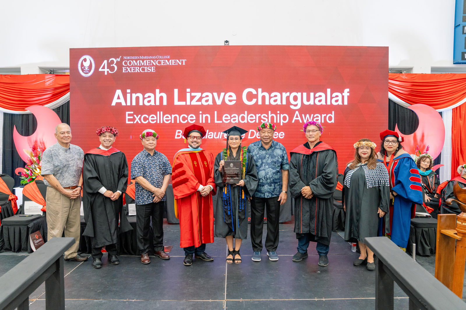 Ainah Lizave Tomokane Chargualaf, who graduated magna cum laude with a Bachelor of Science degree in Education with a concentration in Rehabilitation and Human Services, was honored with the Excellence in Leadership Award at Northern Marianas College’s 43rd Commencement Exercises on May 17, 2024, at the Marianas High School Gymnasium. Pictured with Chargualaf, from left, are keynote speaker U.S. Congressman Gregorio Kilili Camacho Sablan, NMC Vice President for Administration and Advancement Frankie Eliptico, CNMI Gov. Arnold I. Palacios, NMC President Galvin Deleon Guerrero, EdD, CNMI Lt. Gov. David M. Apatang, NMC Board of Regents Chair Charles Cepeda, NMC Dean of Student Support Services Charlotte Cepeda, and NMC Acting Dean of Academic Programs and Services Dr. Barbara Hunter.