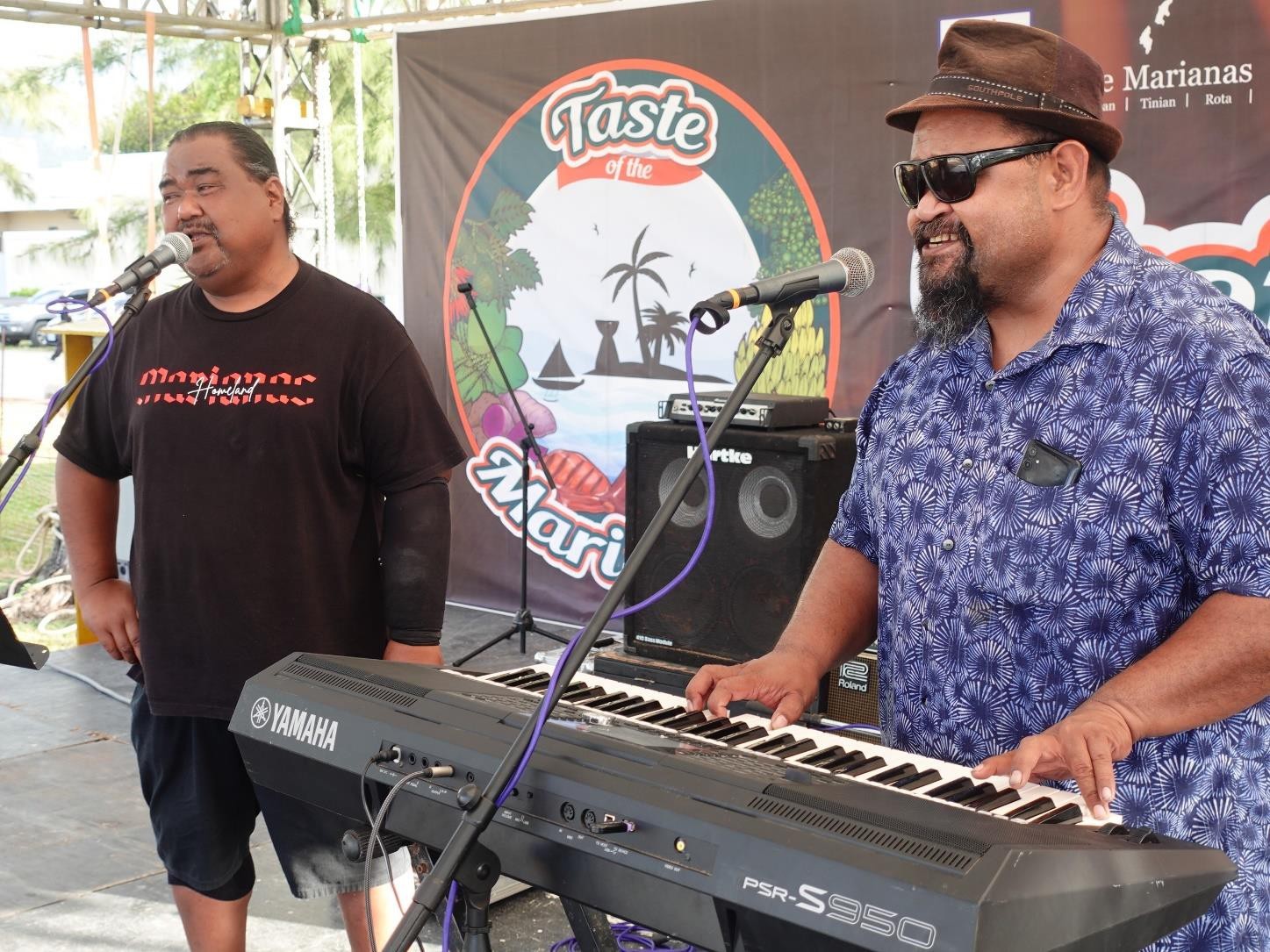 Ace Elamato, right, opens the stage at the 25th Annual Taste of the Marianas International Food Festival on May 4, 2024 at American Memorial Park.