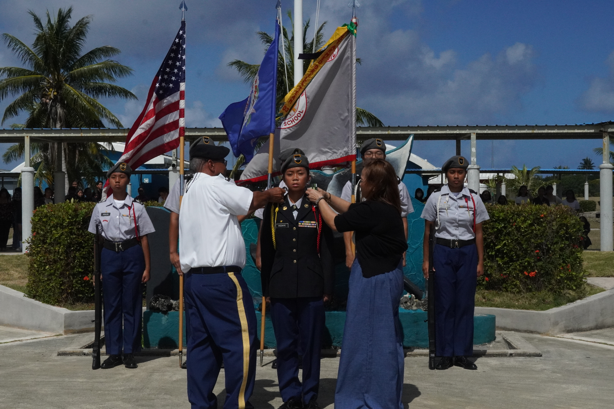 The promotion of the incoming Battalion Commander C/LTC Vicente, Riana by the SAI CSM (ret.) Richard Basa. Also in photo is her mother.