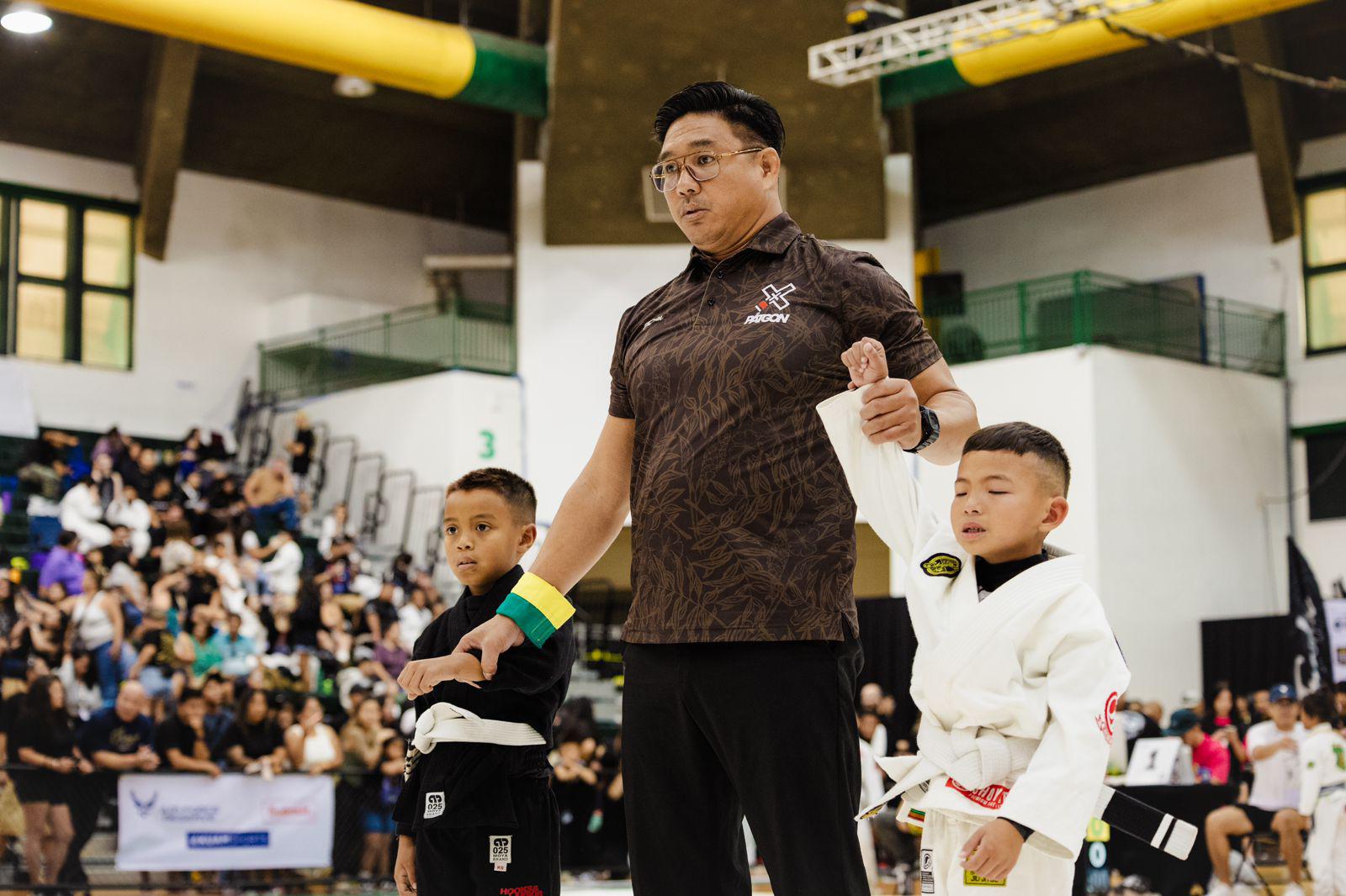 The referee raises Urijah Sablan's hand for winning a match in the 2024 Patgon Jiu Jitsu Tournament at the UOG Calvo Field House in Mangilao, Guam on Saturday, April 27.