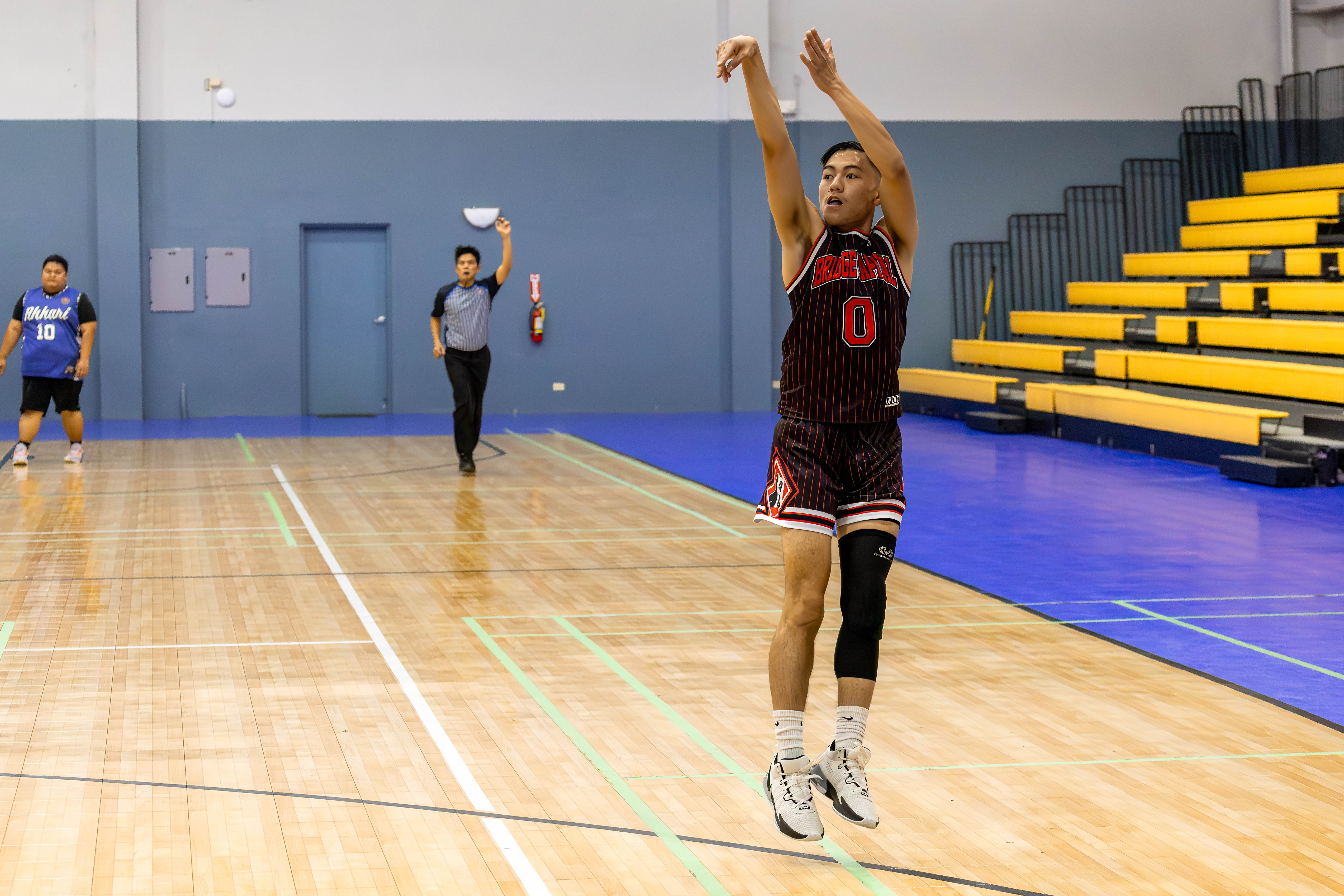 Bridge Capital's Steve King takes the uncontested three-point shot against 670 Akkari Ruuw 2 during a Michelob Ultra Cup 2024 game at the Ada gym on Sunday.