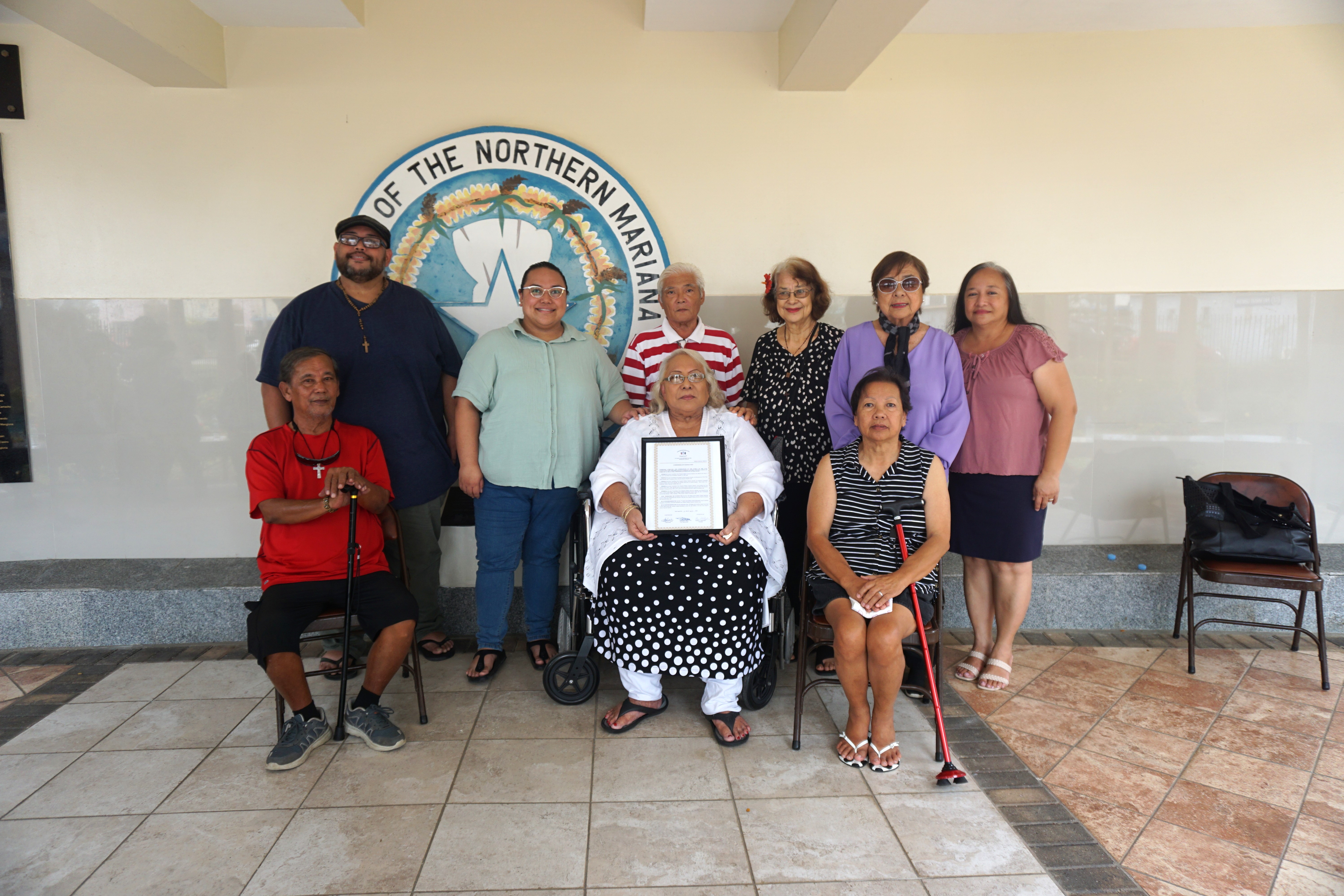 The Saipan and Northern Islands Municipal Council members with the family members of the late Jose Sanchez.