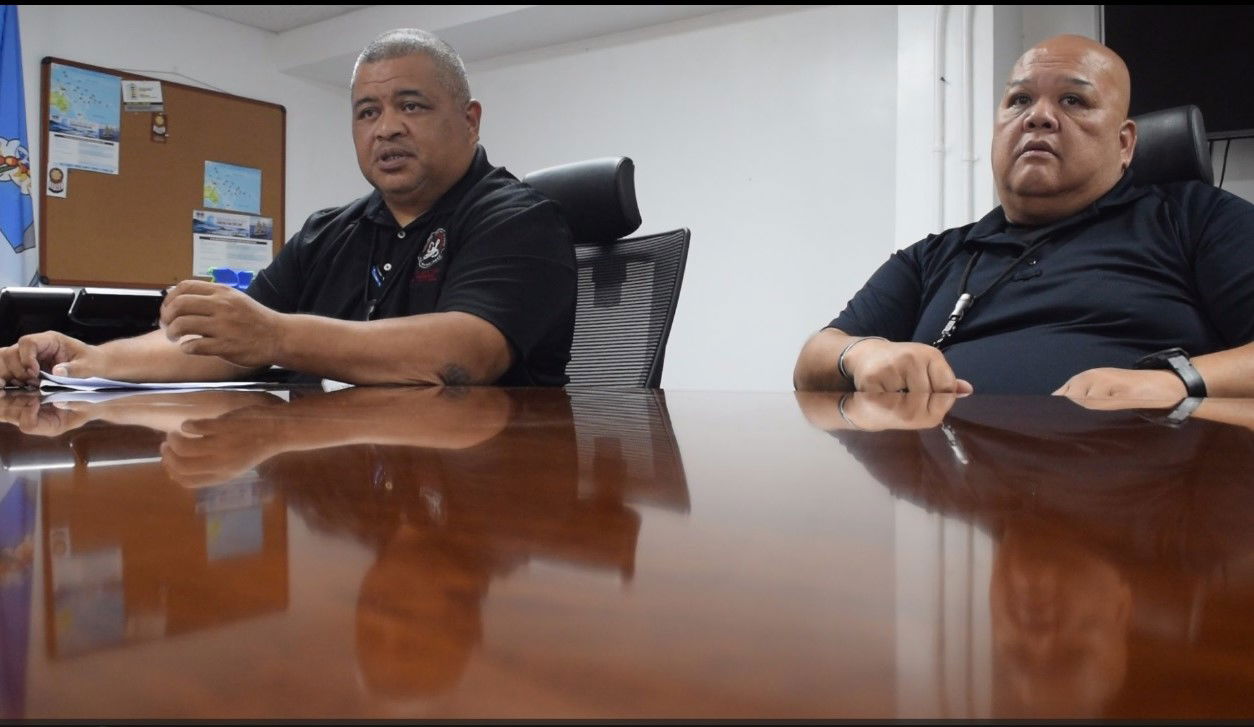 Police Sgt. Fred Sato, left, the Department of Public Safety public information officer, and acting DPS Commissioner Anthony Macaranas conduct a press conference Friday afternoon.
