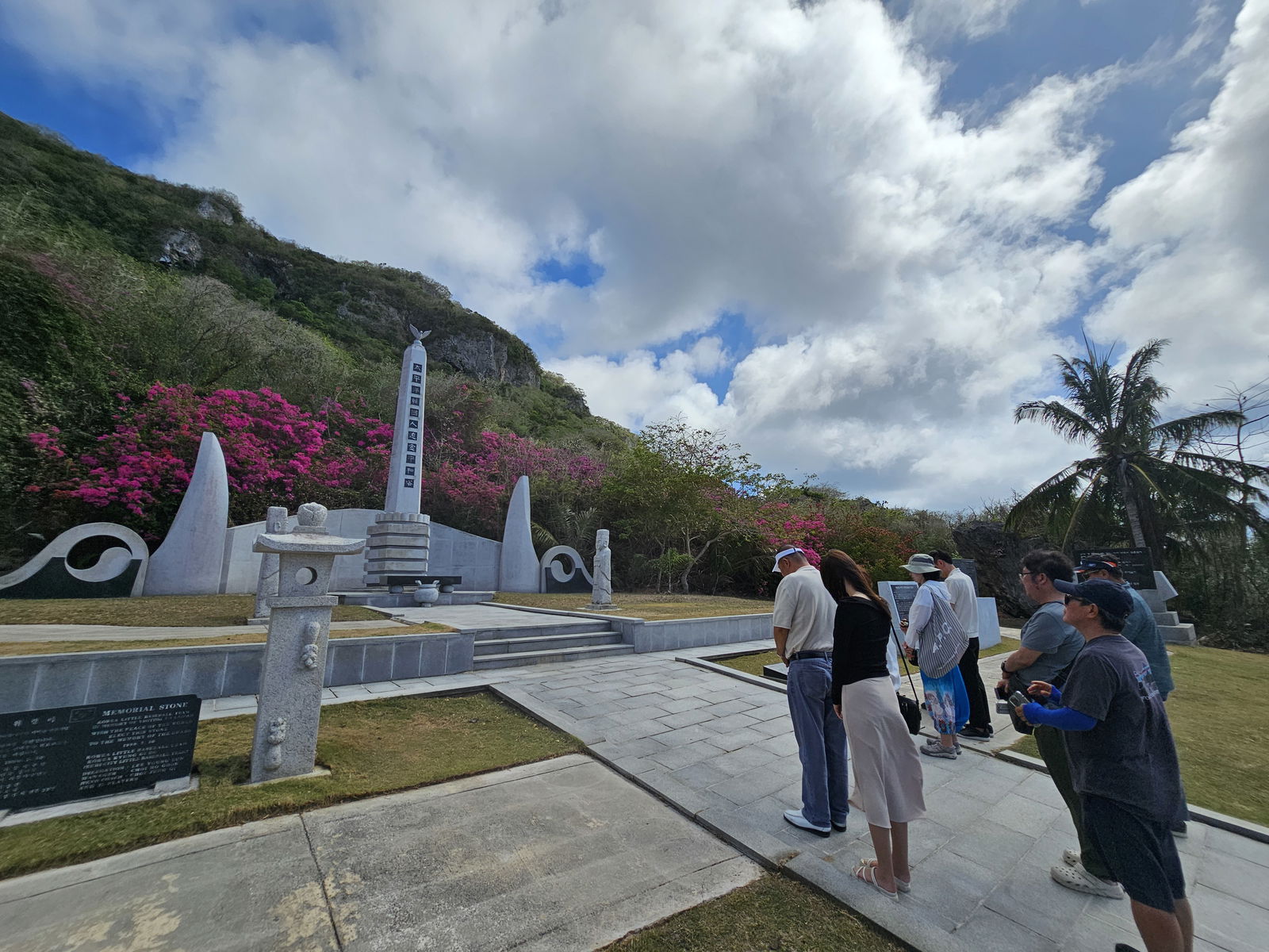 Representatives of eight Korean media outlets and their guides pay their respects at the Korean Memorial in Saipan.  The memorial commemorates those who lost their lives during World War II.  The media were in the Marianas to prepare news and entertainment coverage on the destination in coordination with the Marianas Visitors Authority.