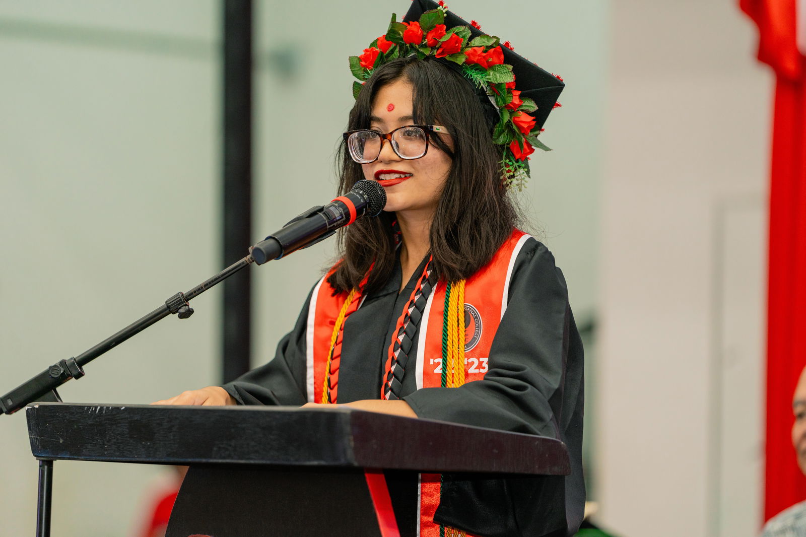 Anushi Joshi, the speaker for Northern Marianas College’s Class of 2024, delivers her address.