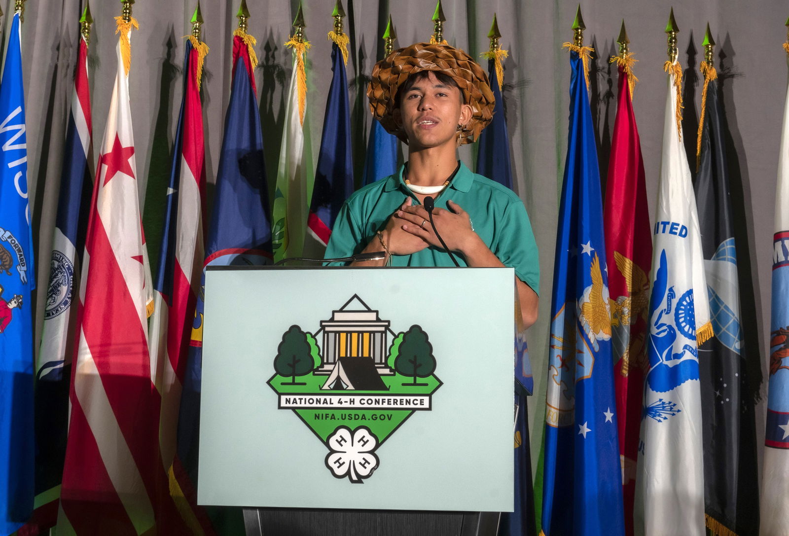 Joseph Santos Jr. recites the 4-H pledge in Chamorro during the conference opening ceremony.