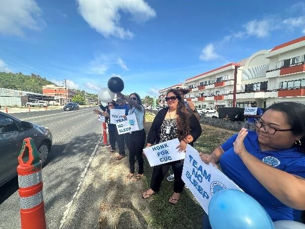 Radiant faces greet motorists.