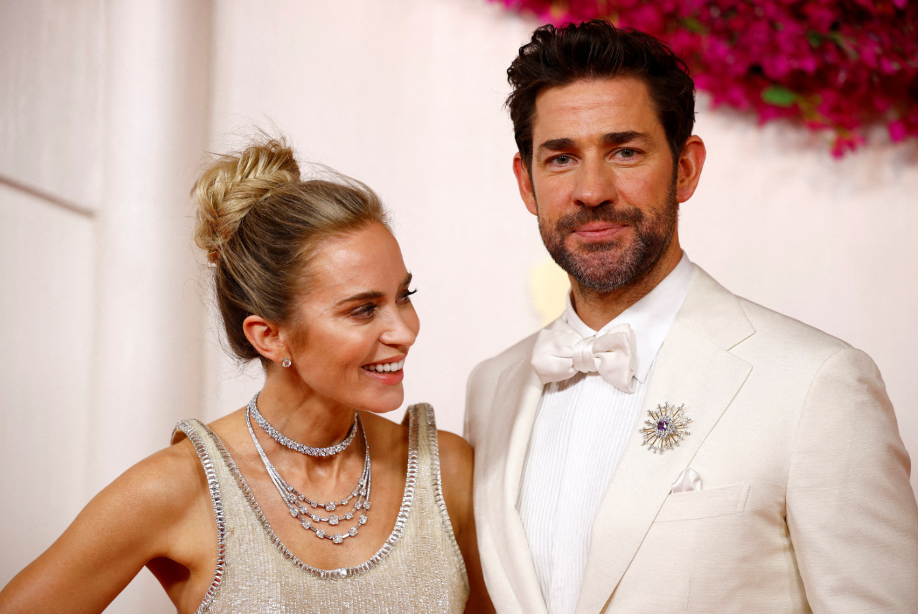 Emily Blunt and John Krasinski pose on the red carpet during the Oscars arrivals at the 96th Academy Awards in Hollywood, Los Angeles, California, March 10, 2024.