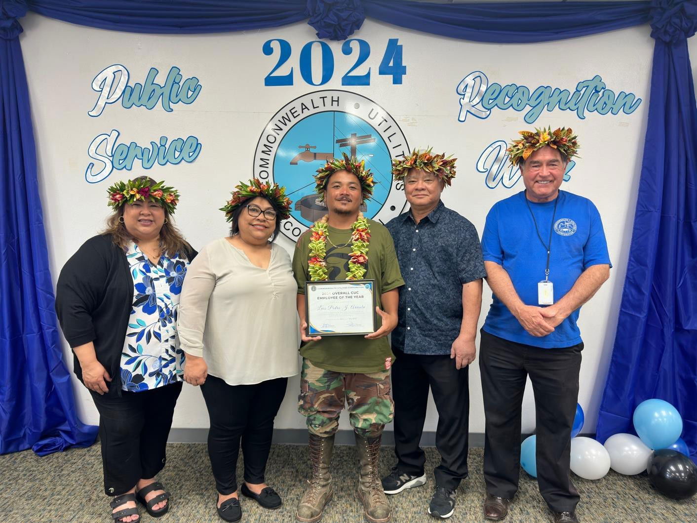 Luis J.  Arriola, a trades technician lineman certified under the Pacific  Lineman Training program,  was named the Commonwealth Utilities Corporation’s 2024   Overall   Employee of the Year during a public service recognition ceremony on May 23, 2024. Pictured with Arriola, from left, are acting CUC Executive Director Betty Terlaje, CUC Board Chair Janice Ada Tenorio, Gov.  Arnold I. Palacios, and CUC Deputy Executive Director Kevin Watson, MPA. CUC officials and employees also held a roadside waving activity to thank their customers.