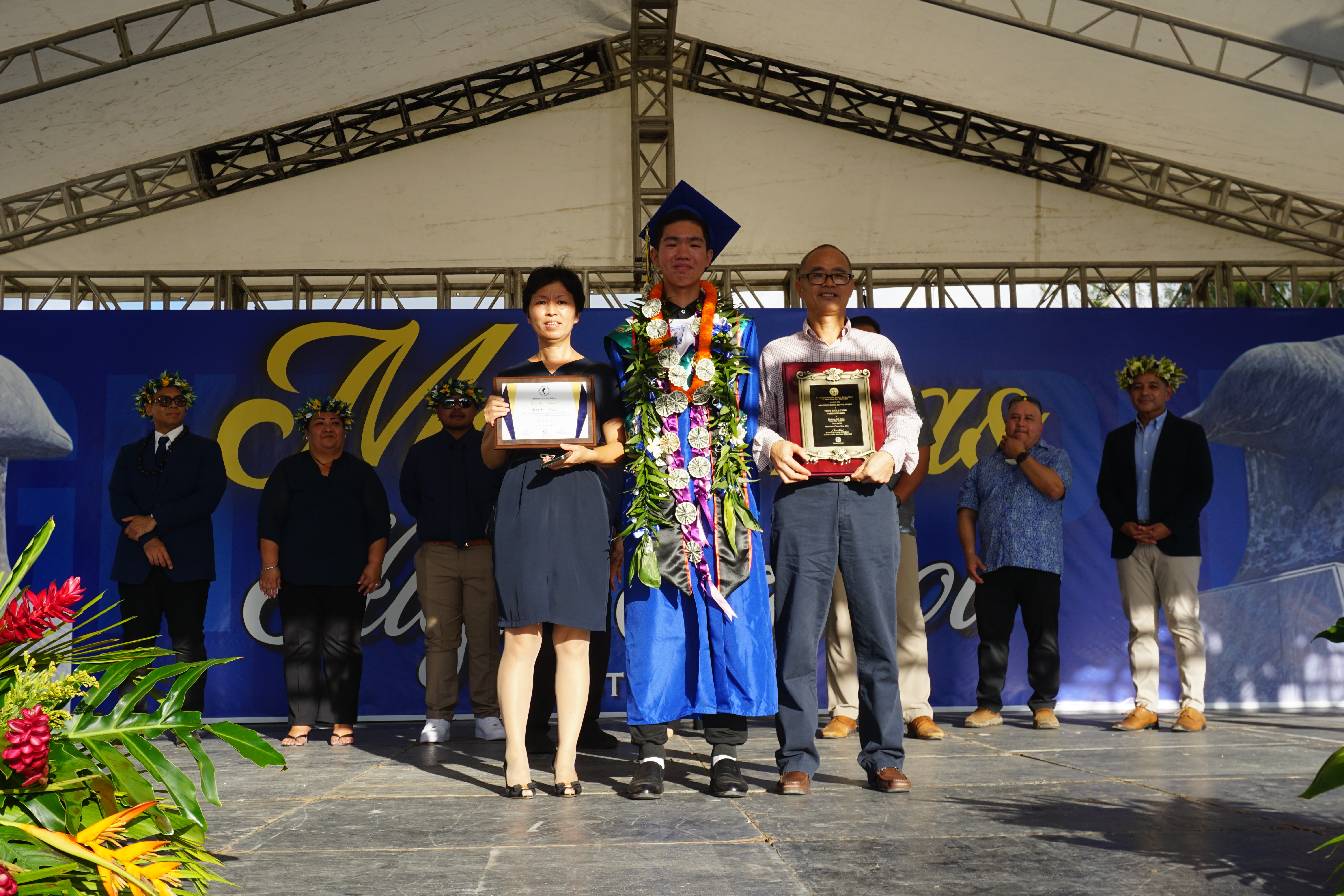 Class Valedictorian Pony Tang and his parents.