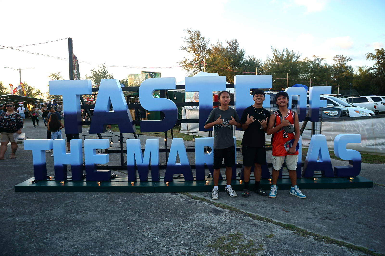 Mount Carmel School eighth graders Jeffrey "Pepero" Concepcion, left, Enzo Sasamoto and Patrick Guerrero pose for a photo at the Taste of the Marianas.