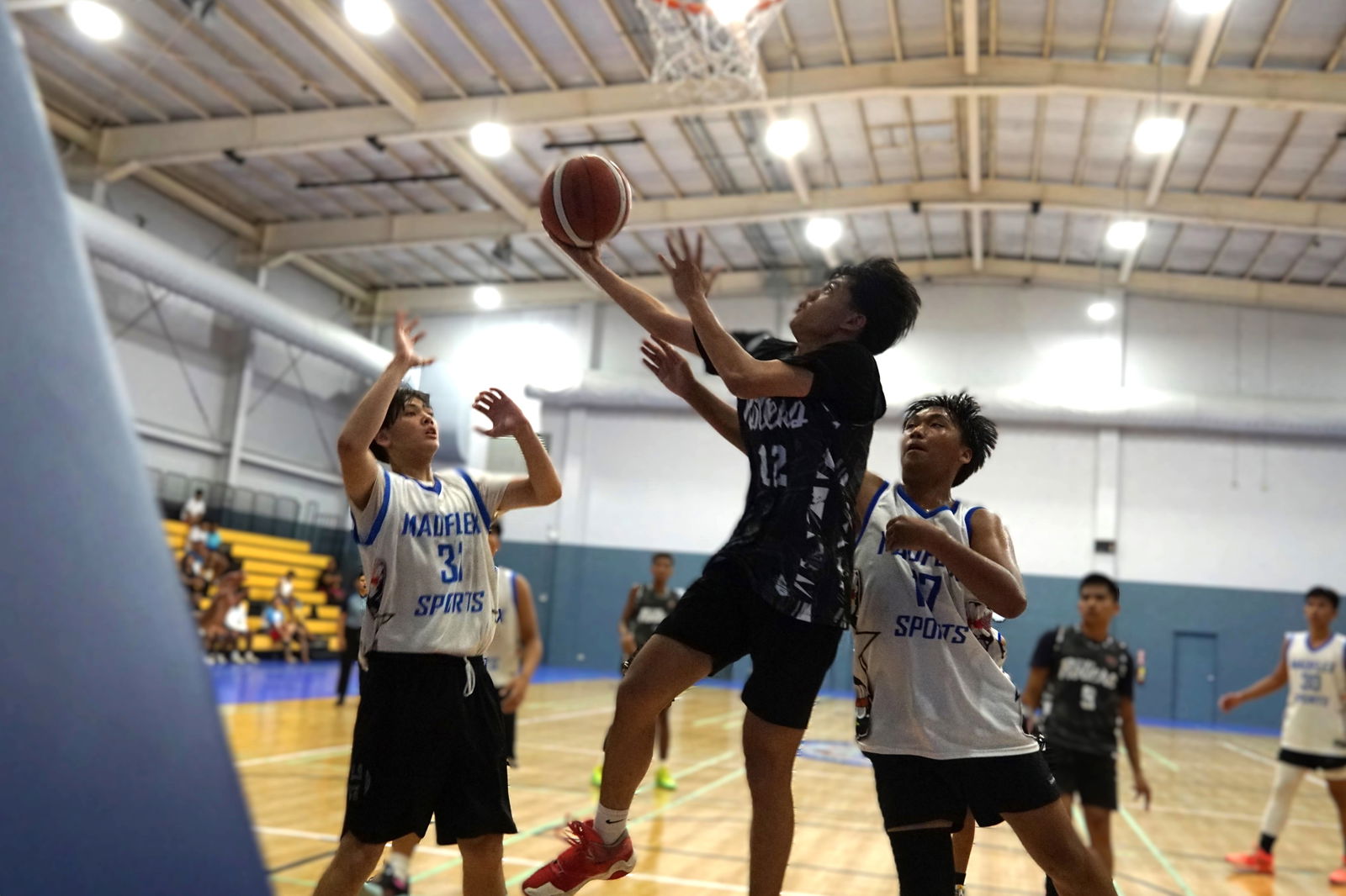 670 Rollers' Marc Tengco extends for the reverse layup during the Pokka Cup 2024 championship game against Madflex at the Ada gym on Friday.