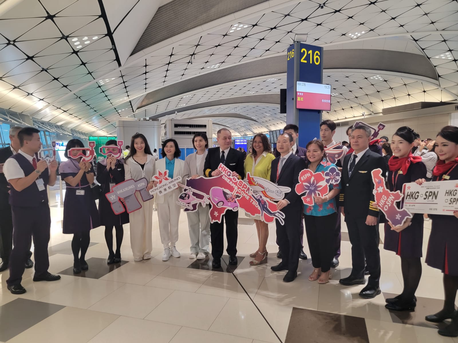 Hong Kong Airlines Chairman Jianfeng “Jeff” Sun, center, Marianas Visitors Authority Chairwoman Gloria Cavanagh, sixth right, MVA Deputy Managing Director Judy C. Torres, fourth right, and other dignitaries and flight crew hold a press conference at Hong Kong International Airport on April 28, 2024, prior to Hong Kong Airlines flight to Saipan.  It was the first flight to the Marianas from Hong Kong and China since before the pandemic.