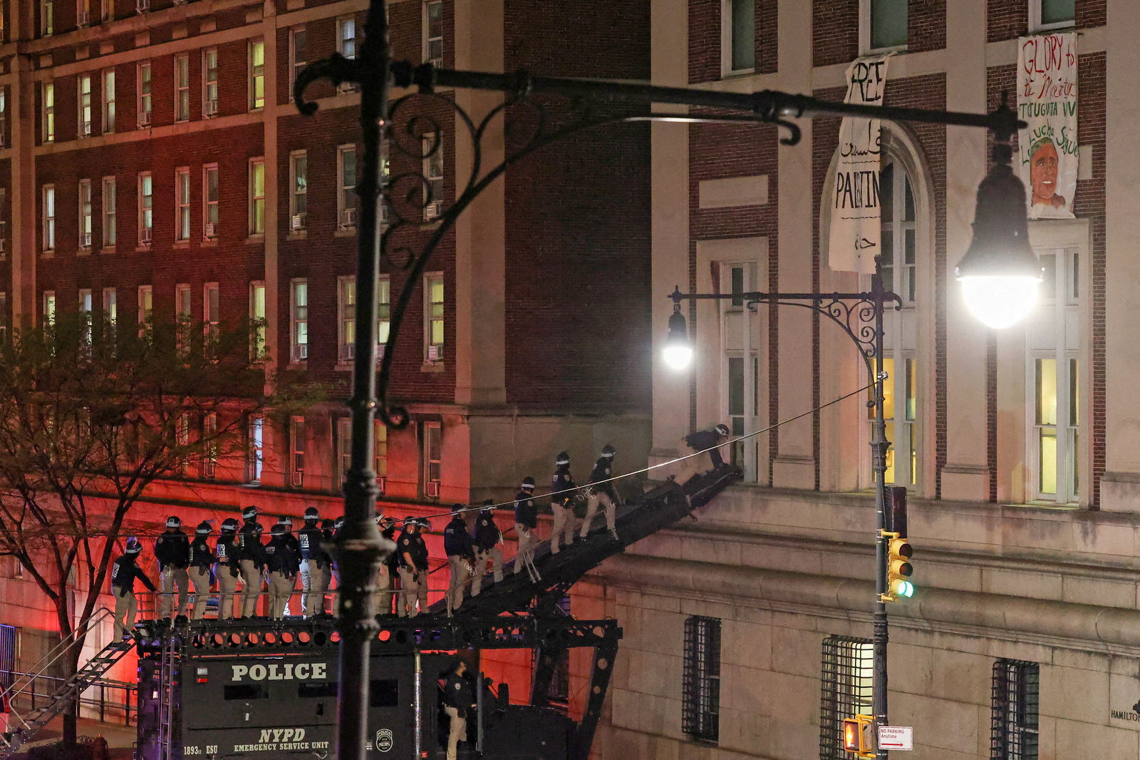 Police use a special vehicle to enter Hamilton Hall which was occupied by protesters, as other officers enter the campus of Columbia University in New York City, April 30, 2024.