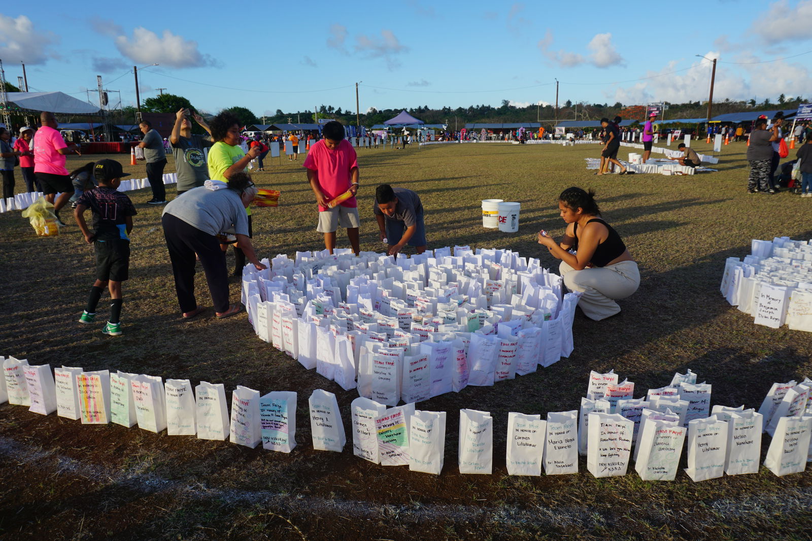 Volunteers prepare the luminaries.