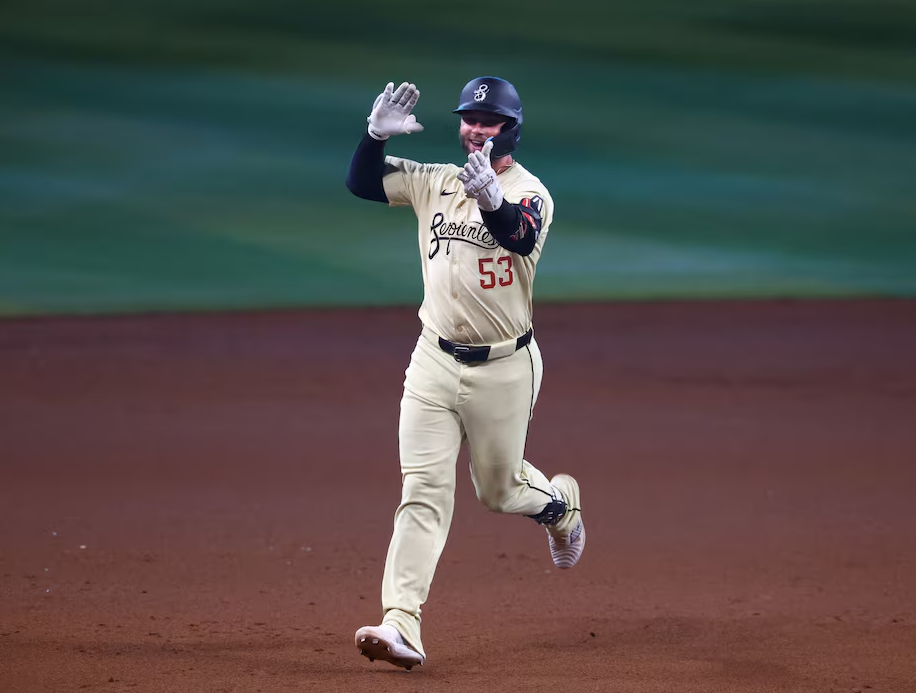 Arizona Diamondbacks first baseman Christian Walker celebrates as he rounds the bases after hitting a two run walk off home run in the tenth inning against the Los Angeles Dodgers at Chase Field in Phoenix, Arizona, May 1, 2024.