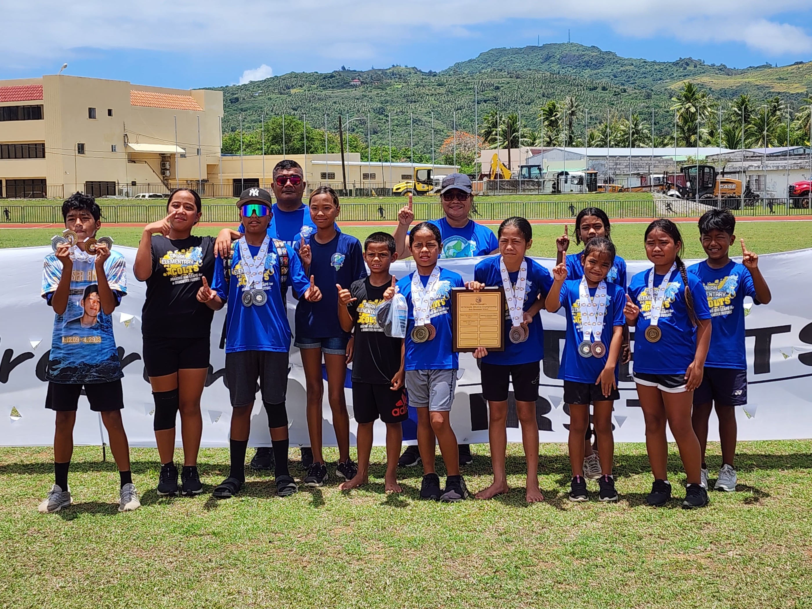 The Tinian Elementary School team members pose with their medals as the title winners in the boys division of the McDonalds-PSS All School Track and Field (Athletics) SY 23-24 at the Oleai Sports Complex on Saturday.