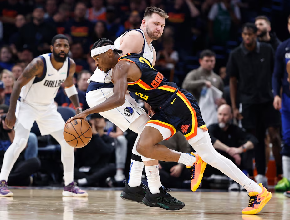 Oklahoma City Thunder guard Shai Gilgeous-Alexander (2) moves past Dallas Mavericks guard Luka Doncic (77) during the second half of game five of the second round for the 2024 NBA playoffs at Paycom Center in Oklahoma City, May 15, 2024.