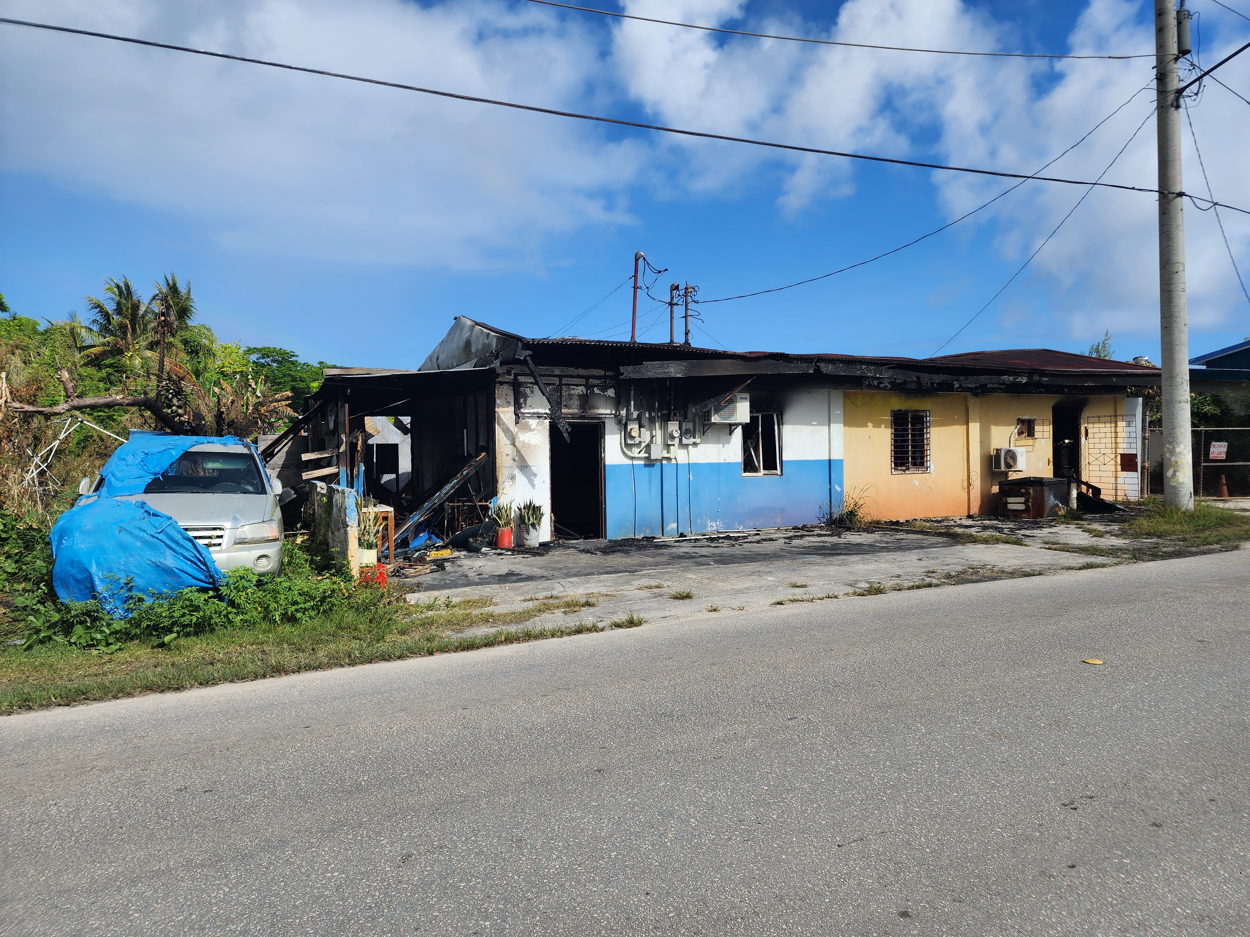 This house was damaged by the fire that broke out at a nearby auto shop in Susupe on Saturday.
