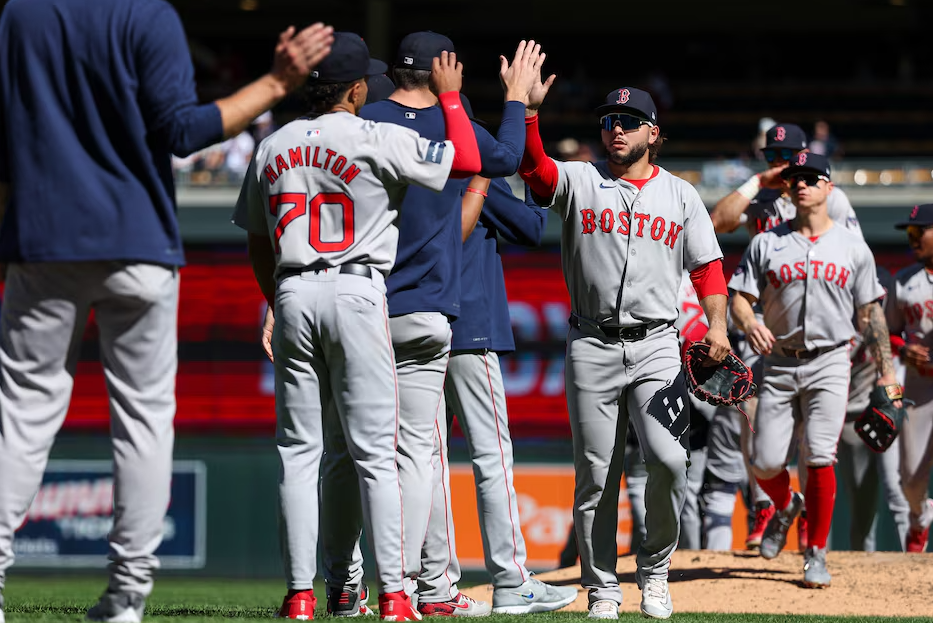 Boston Red Sox players celebrate the win against the Minnesota Twins after the game at Target Field in Minneapolis, Minnesota, May 5, 2024.